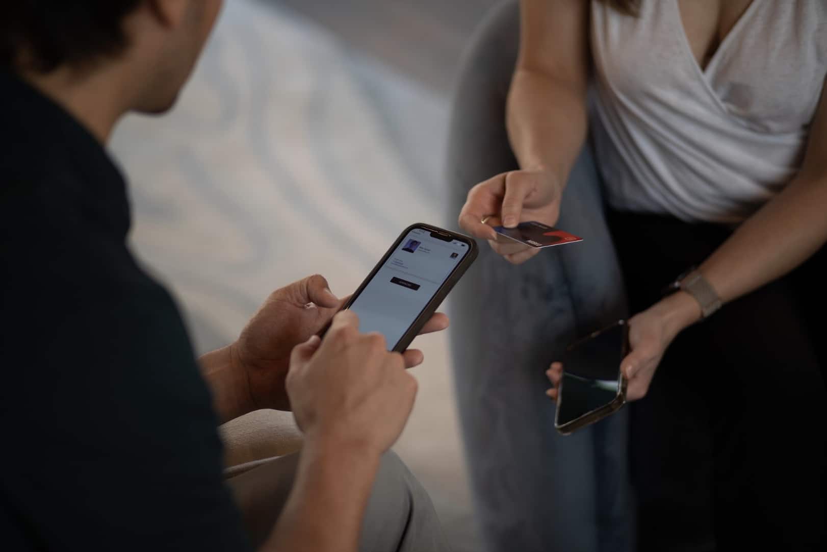 two people sharing digital business cards