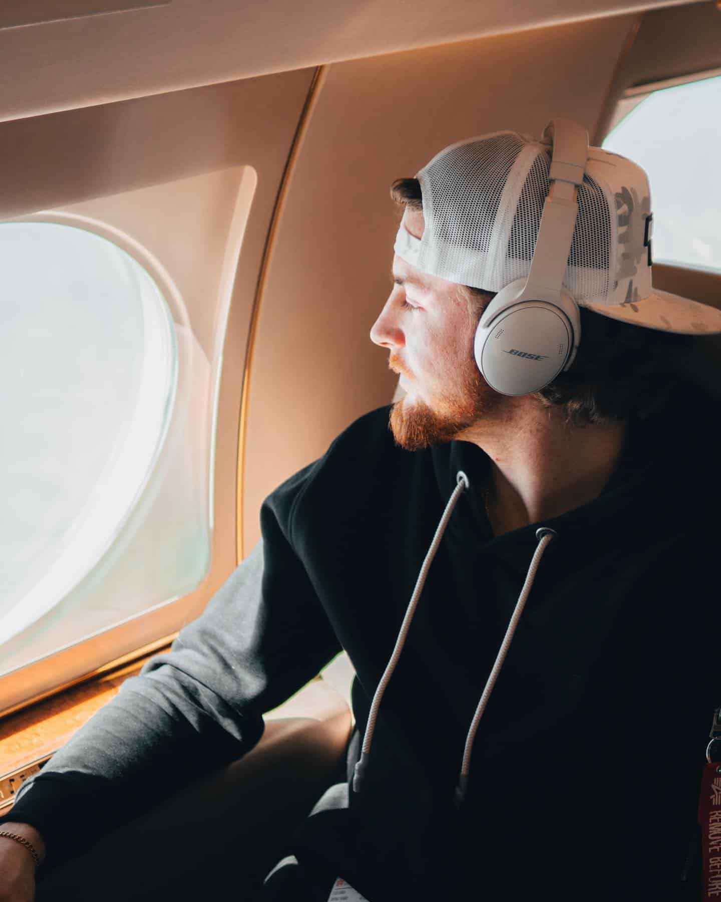 man enjoying the view from the window seat