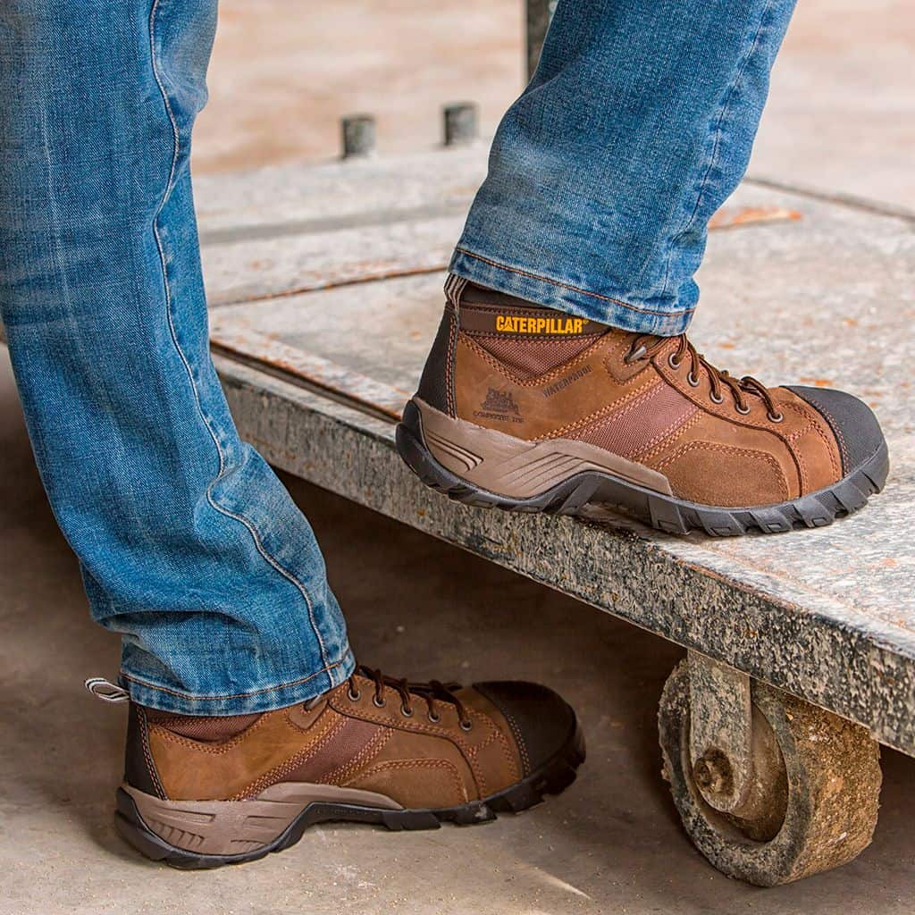 wearing a pair of brown leather work boots