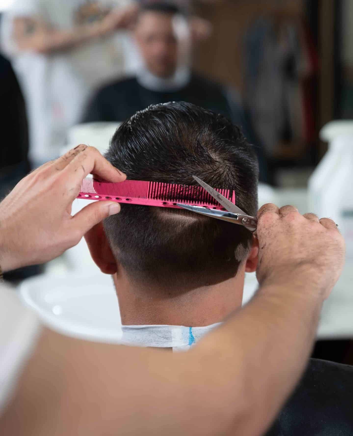 getting a haircut from a barber