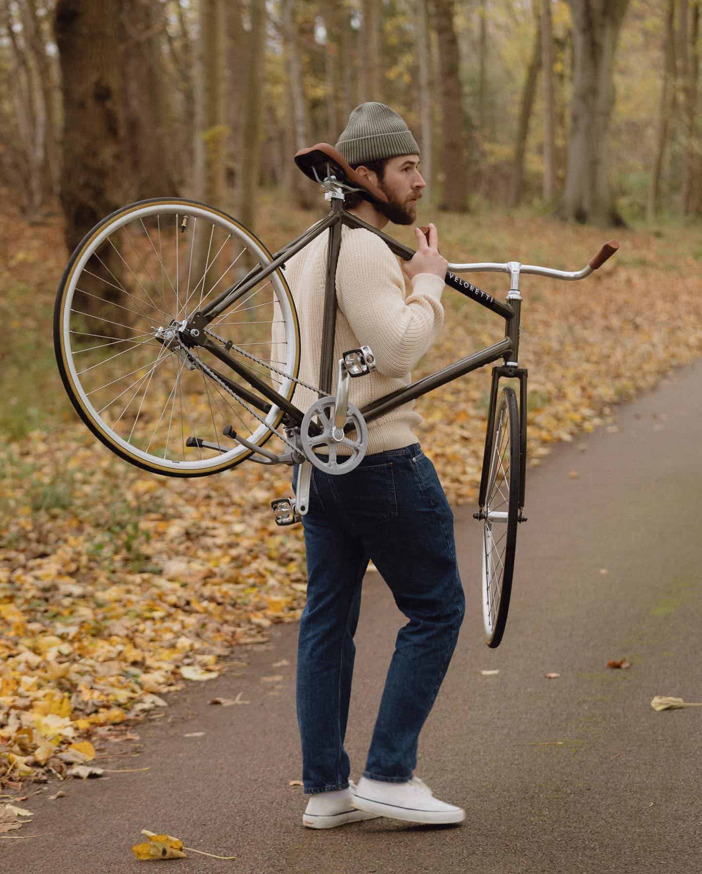man carrying his bike
