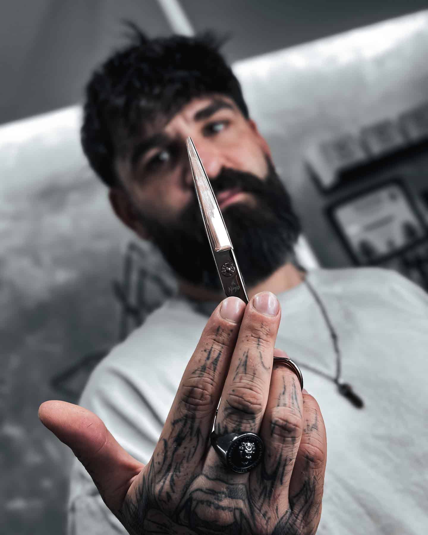 man holding a pair of scissors