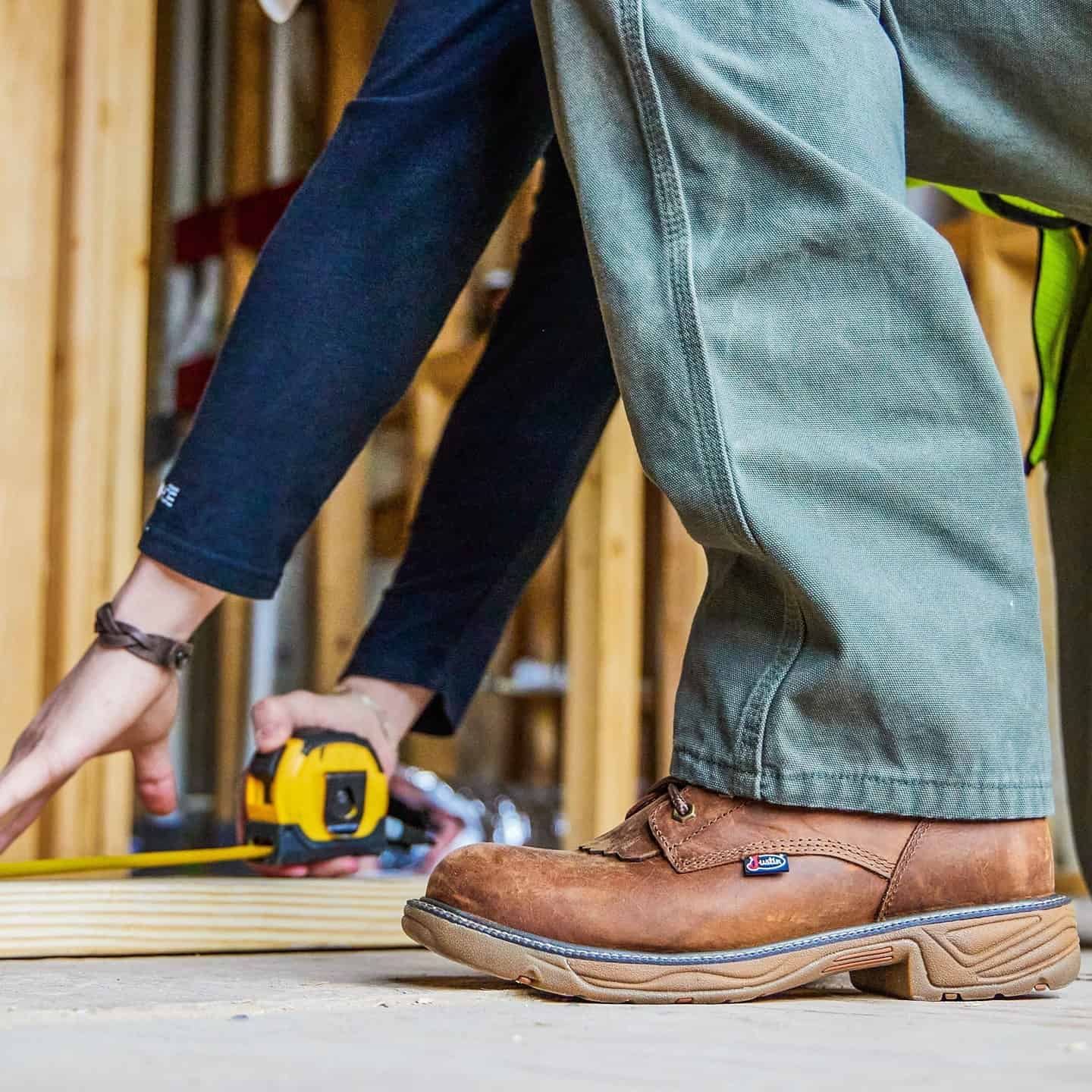 carpenter using a tape measure