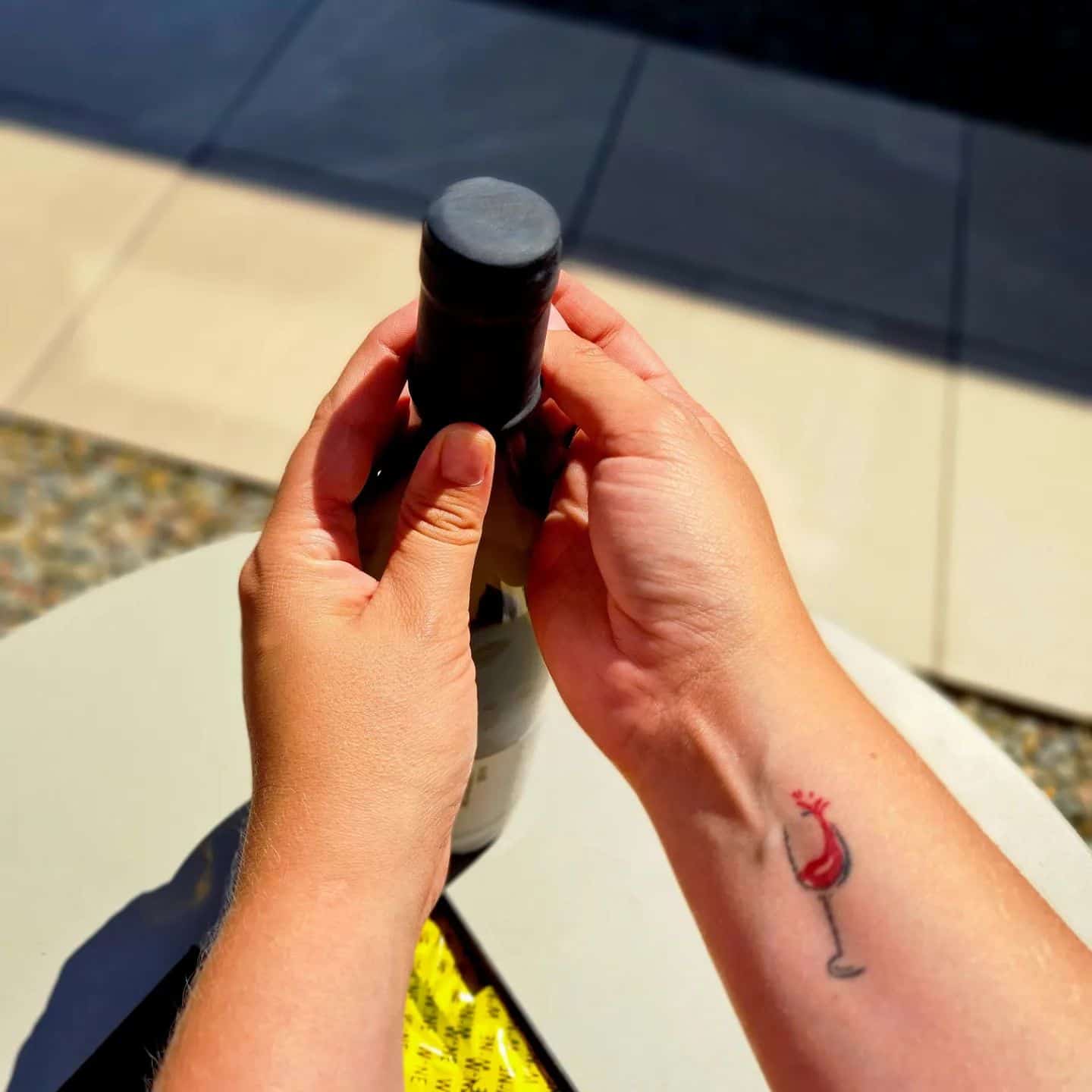 putting on a wine condom