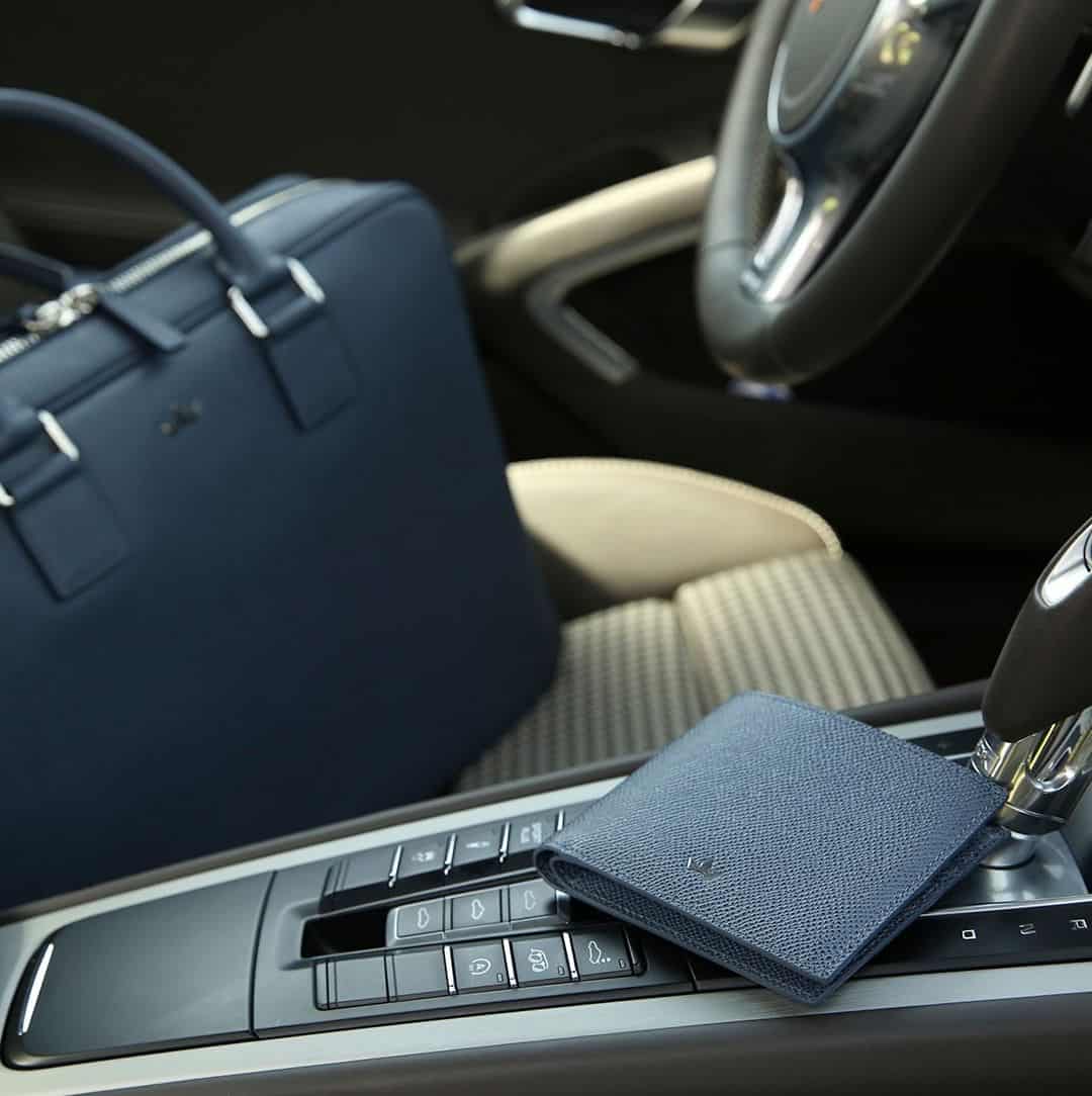 a combination of grained leather wallet and briefcase