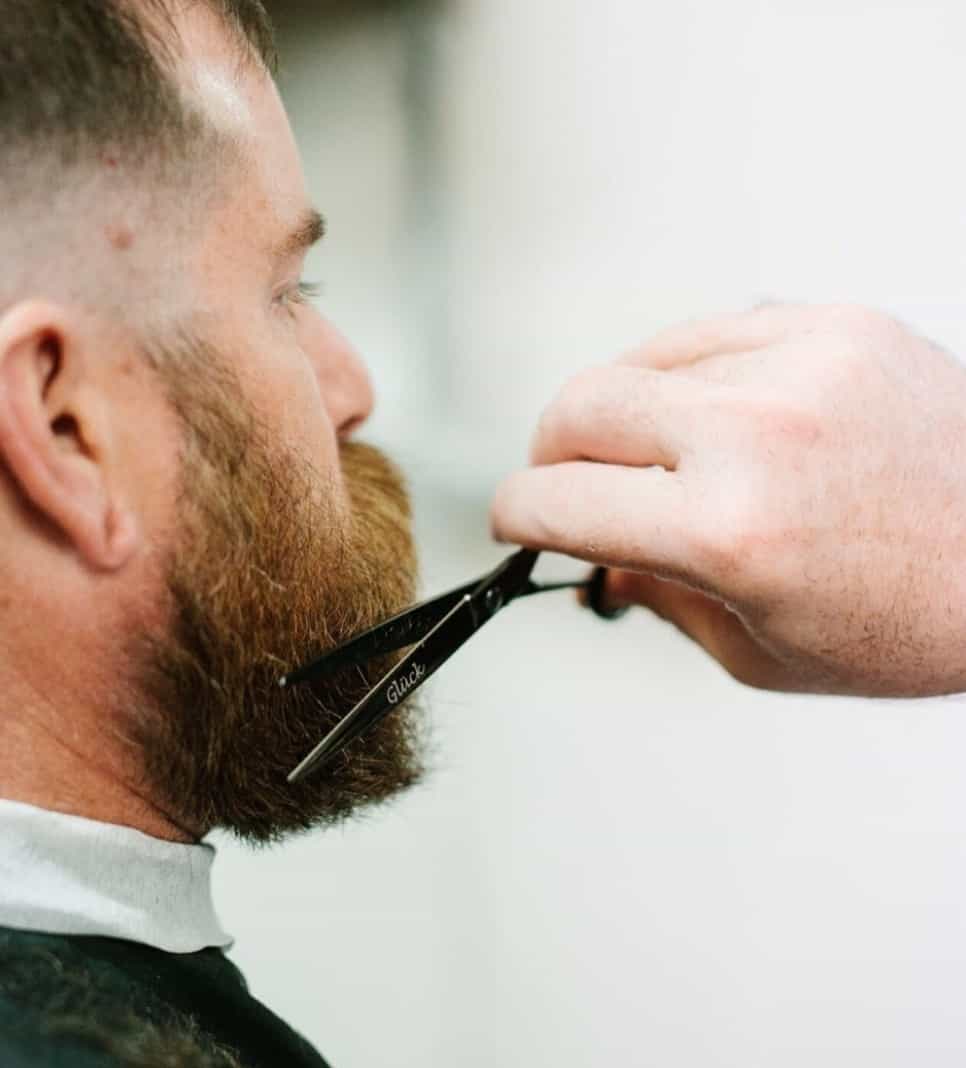 trimming beard with scissors