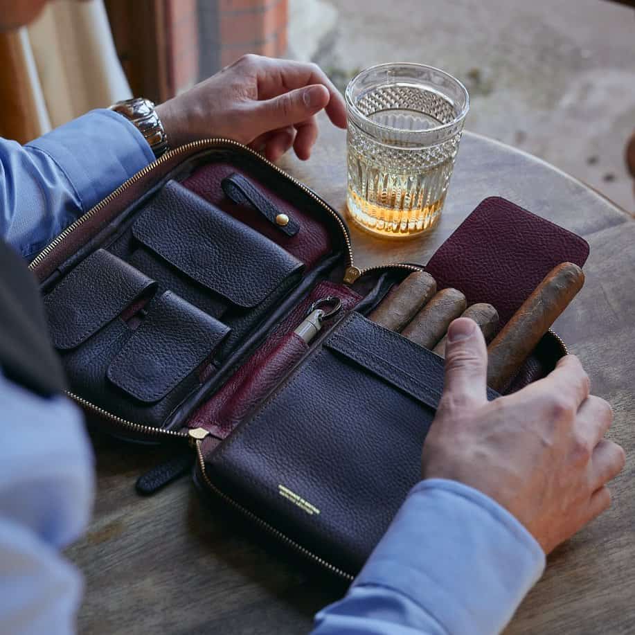 man with an open cigar holder