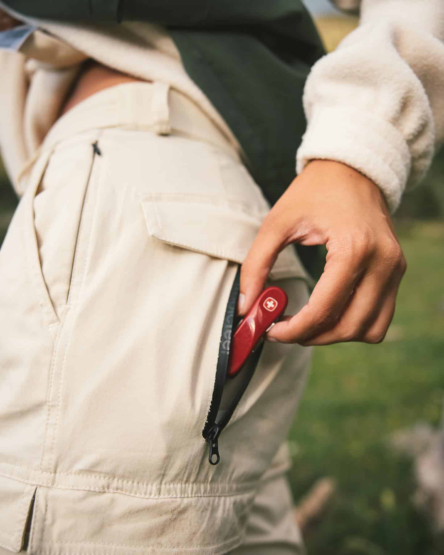 pulling a multi-tool from a back pocket