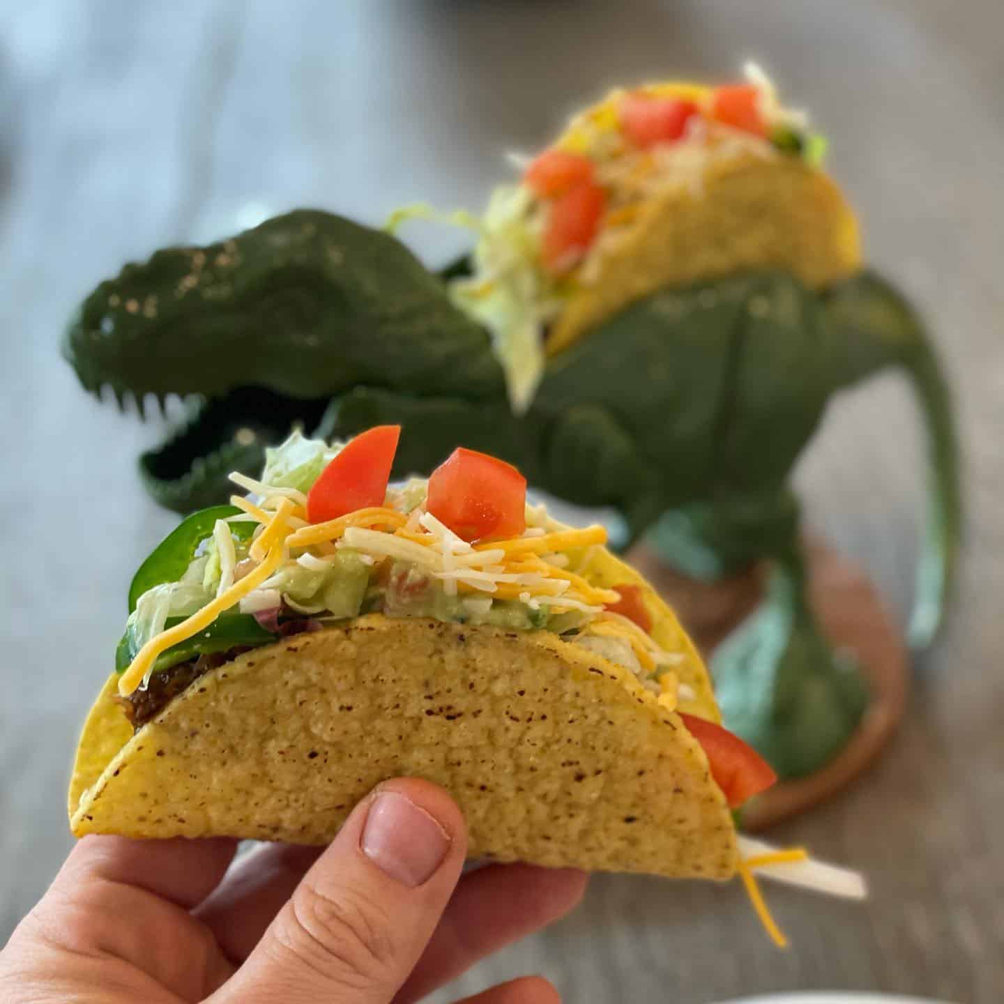 holding a freshly made taco