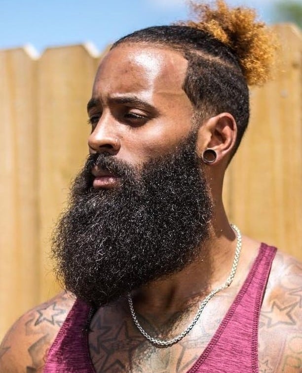 man in a maroon tank top