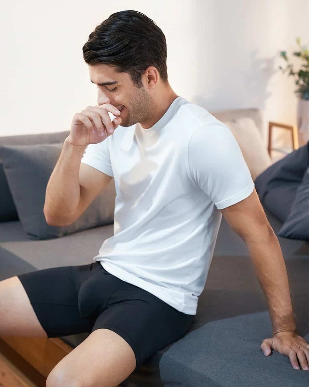 man wearing a white t-shirt and black boxer brief