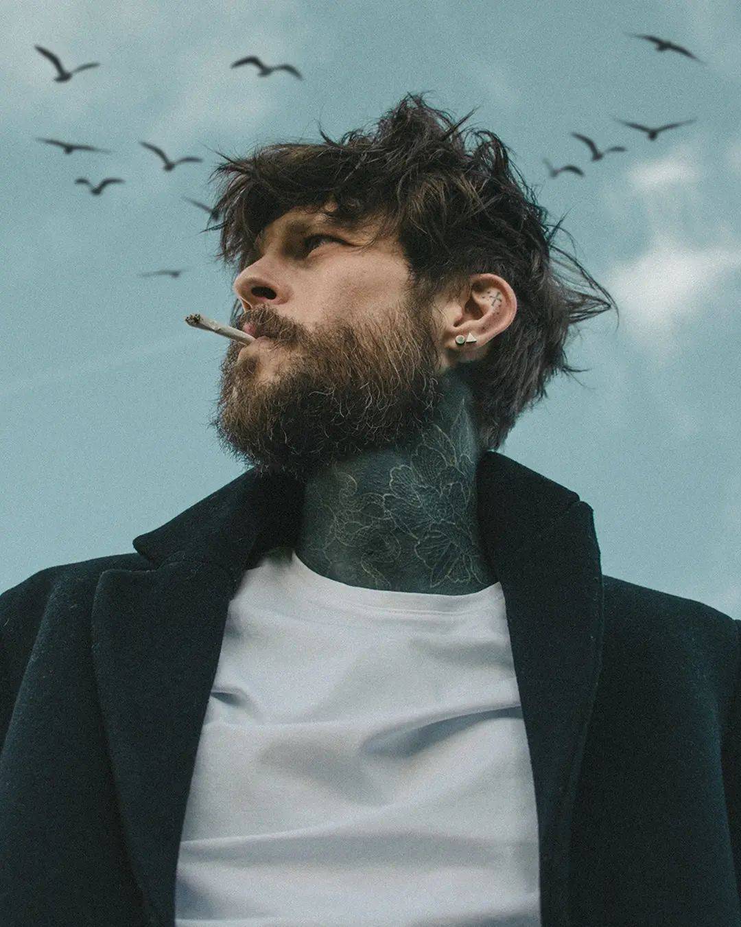 man smoking a cigarette