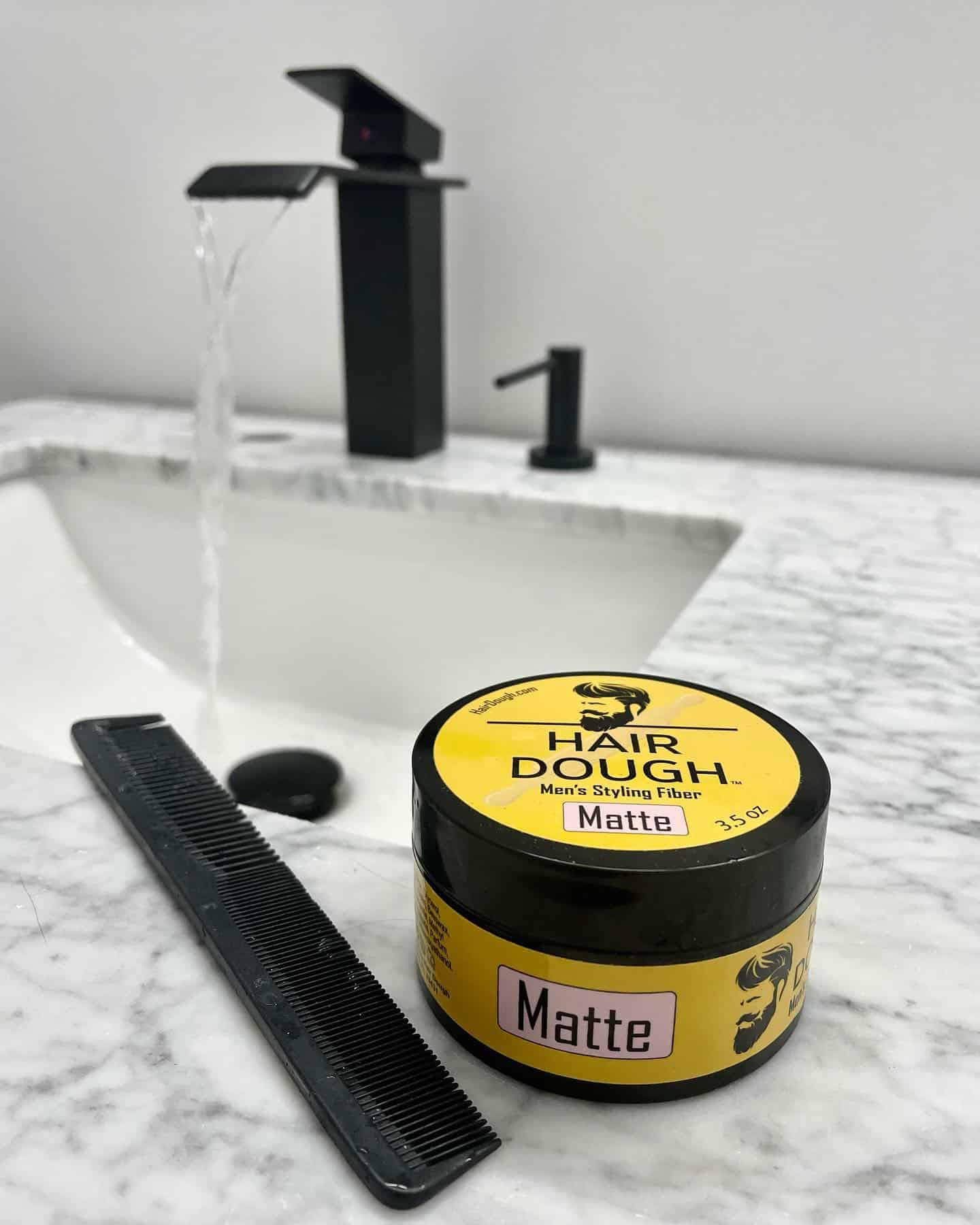 styling fiber and comb on a bathroom sink