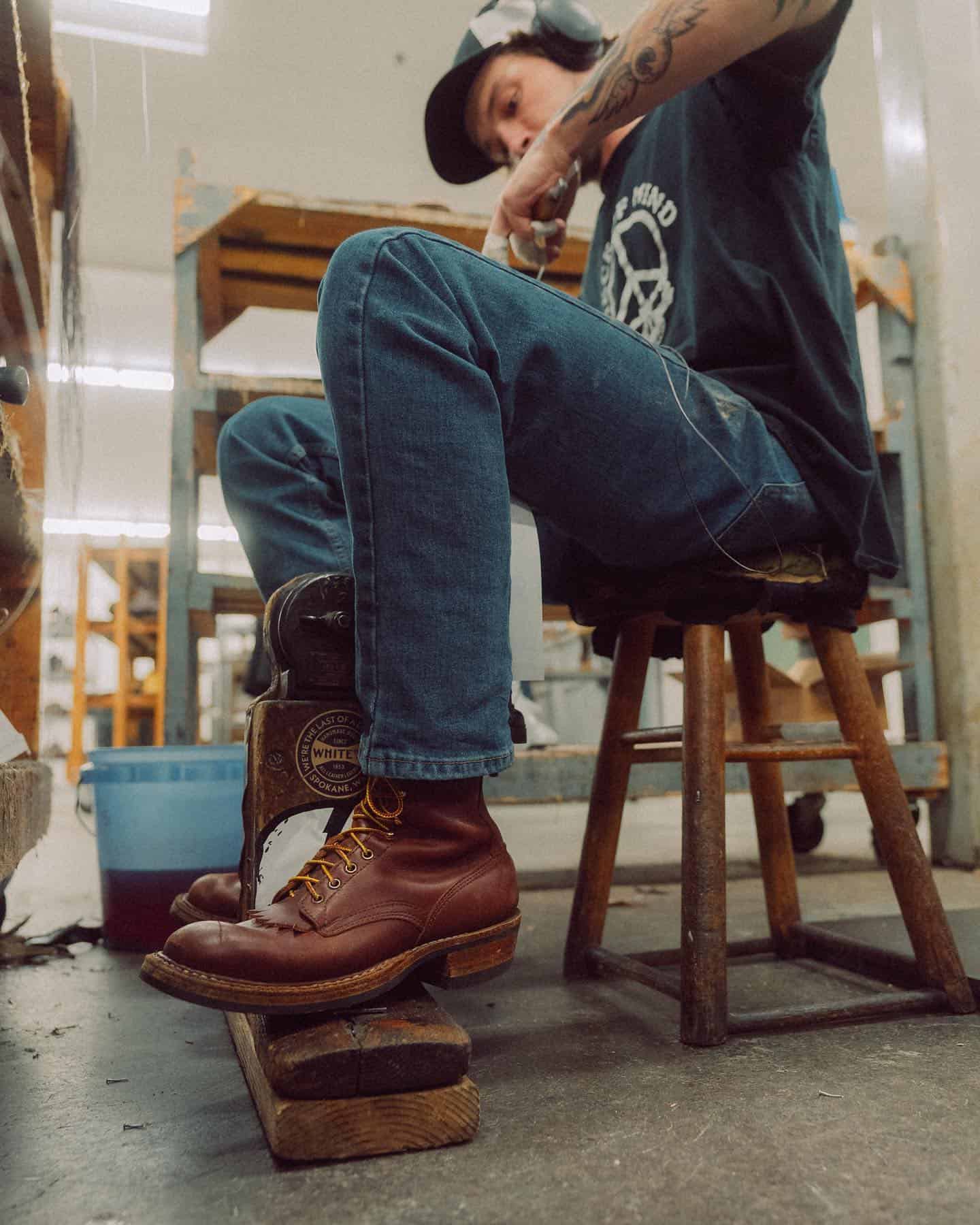 man working in a boot making factory
