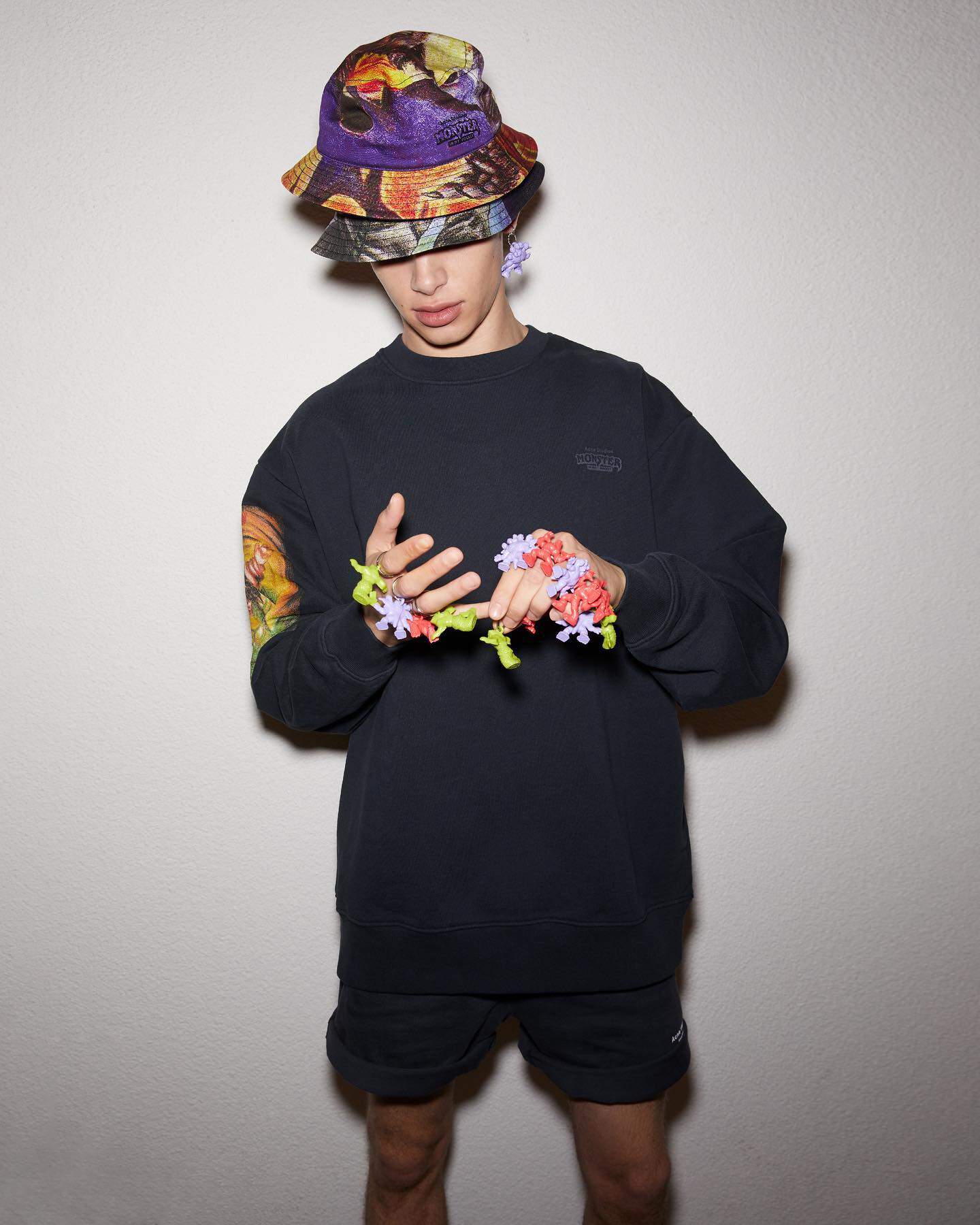 man wearing two bucket hats on top of the other