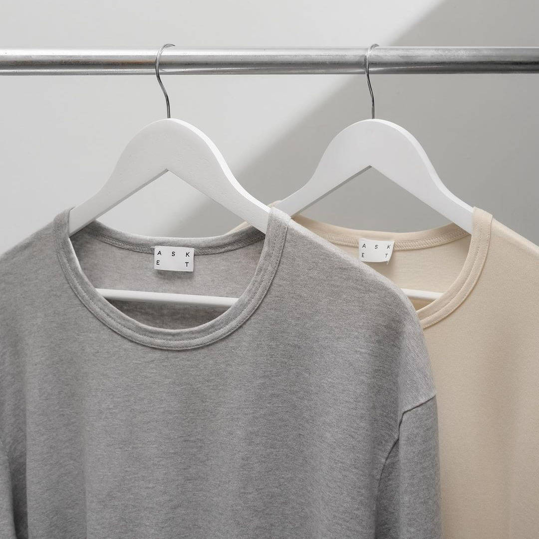 two asket long sleeve t-shirts in clothes hangers