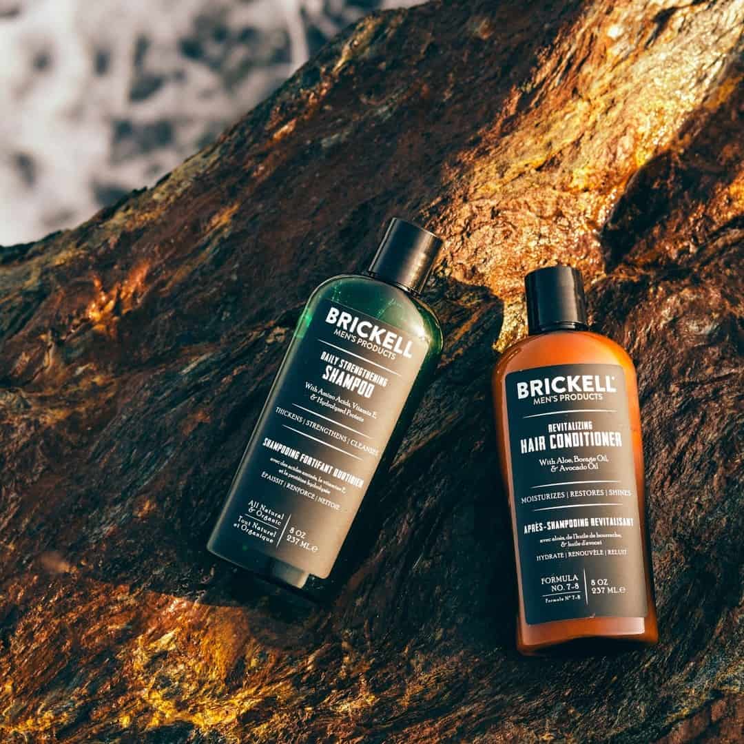 bottles of shampoo and conditioner for men by brickell