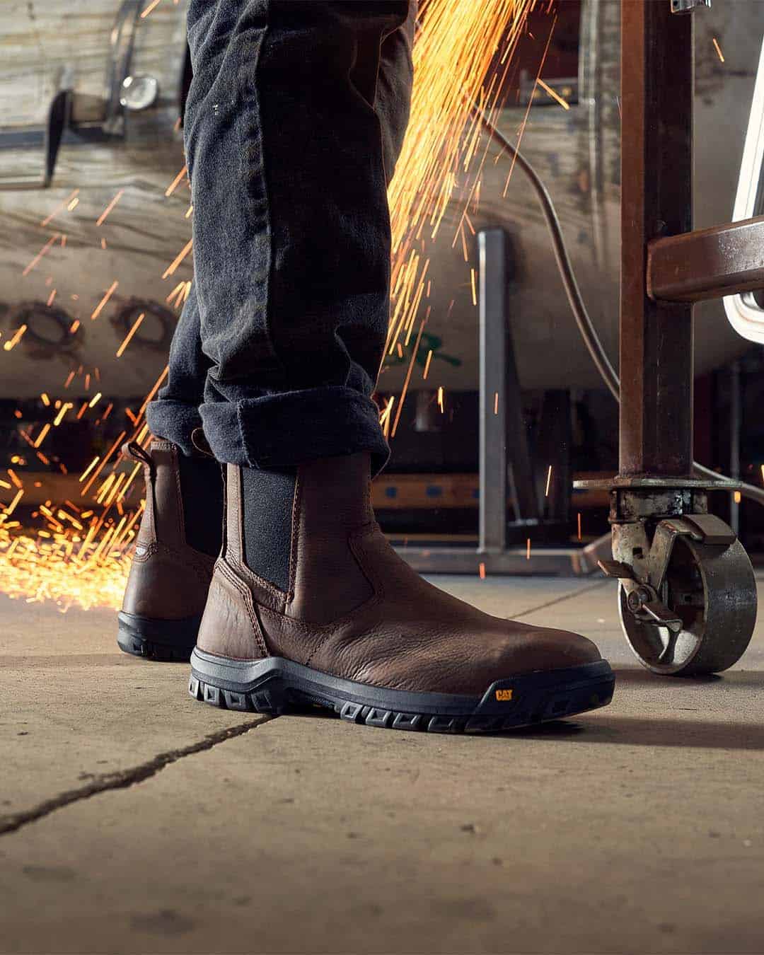 wearing a pair of catwheel base work boots in a workshop