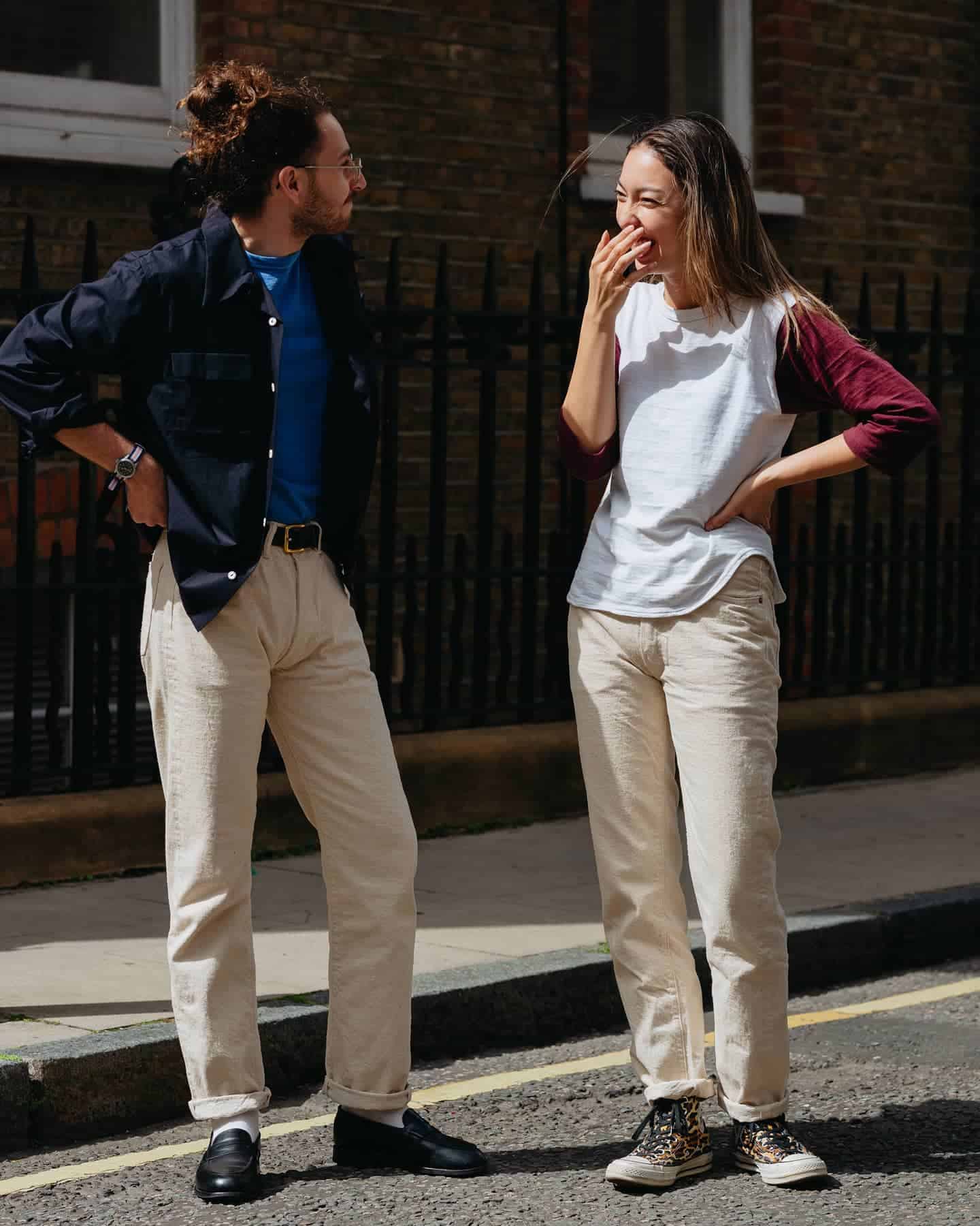 man and woman havinga conversation on the side of the road