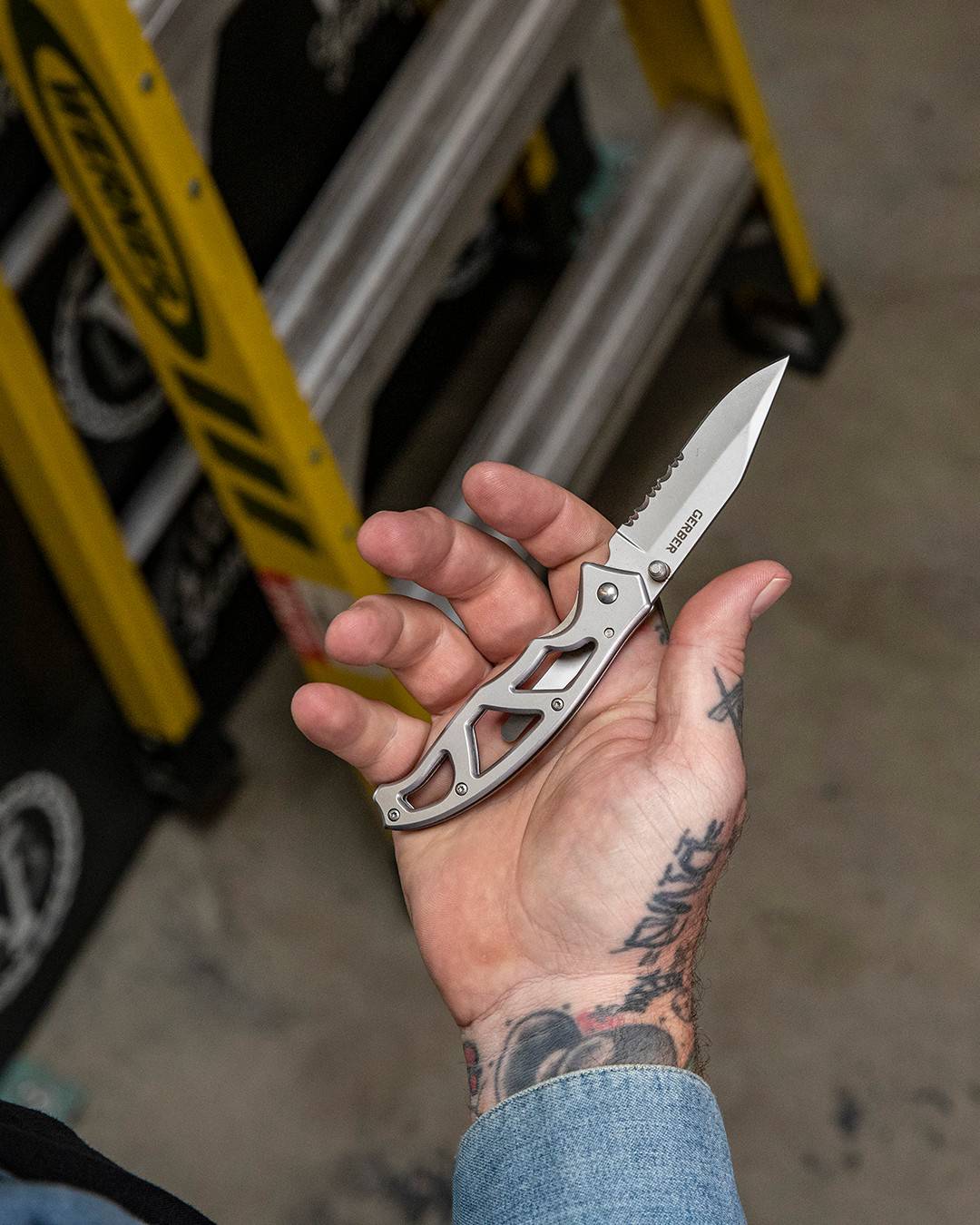 holding a gerber pocket knife