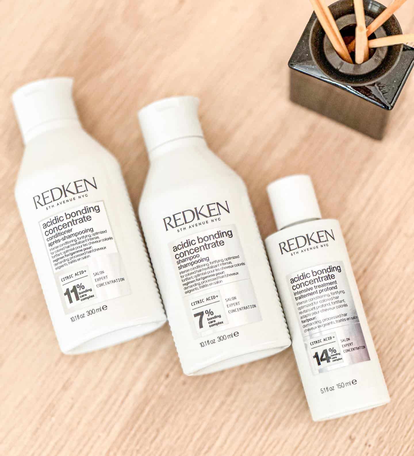 three bottles of redken acidic bonding concentrate