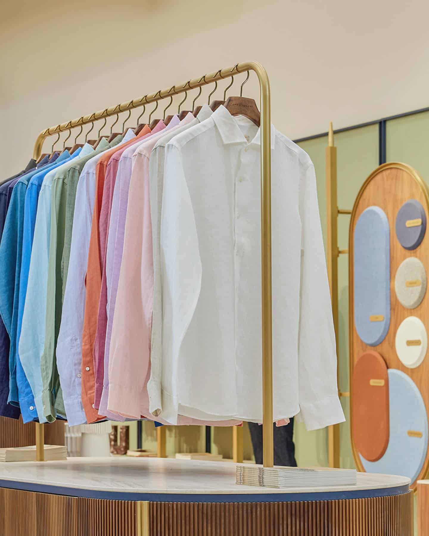 clothes rack with hanging shirts