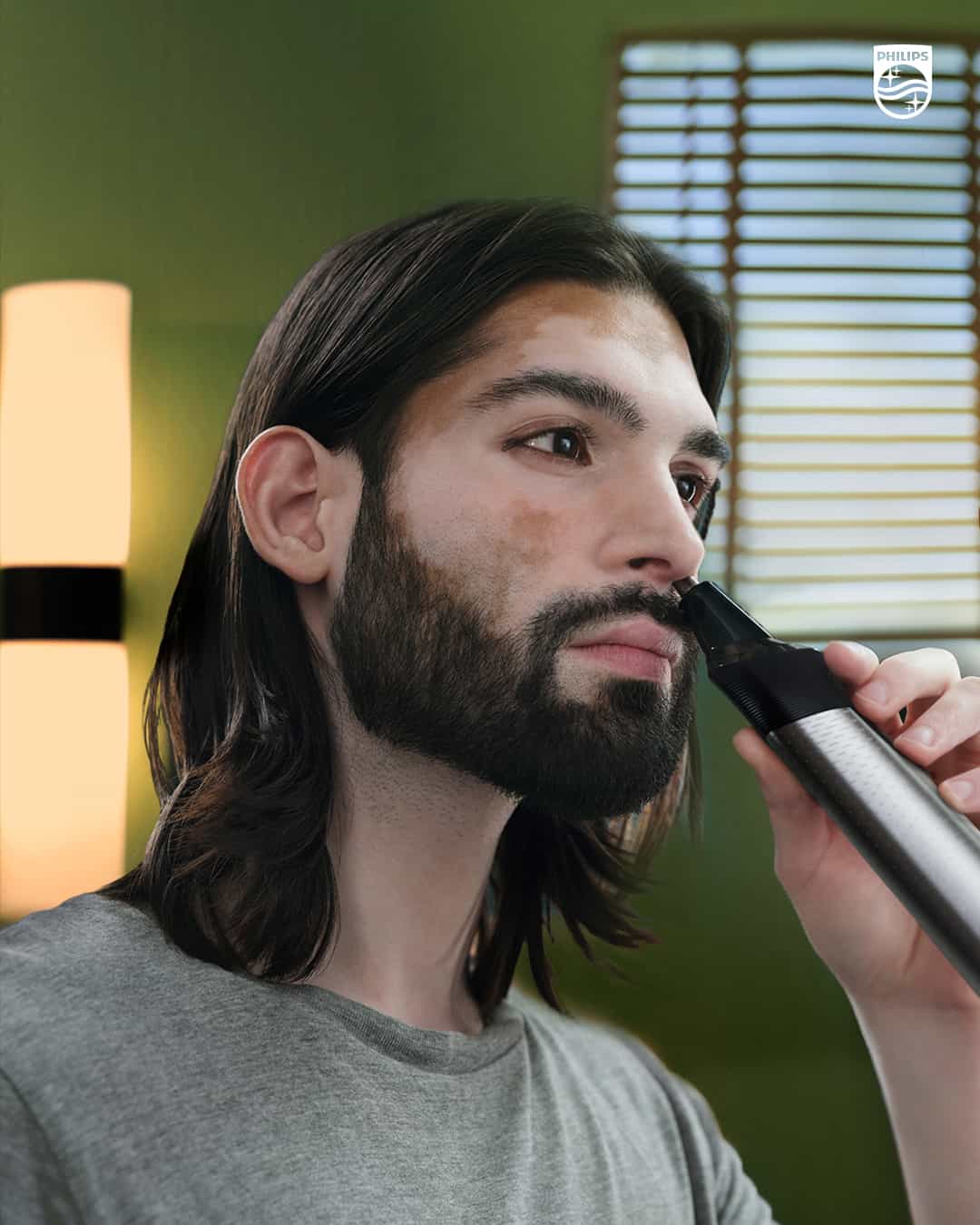 man trimming his nose hair