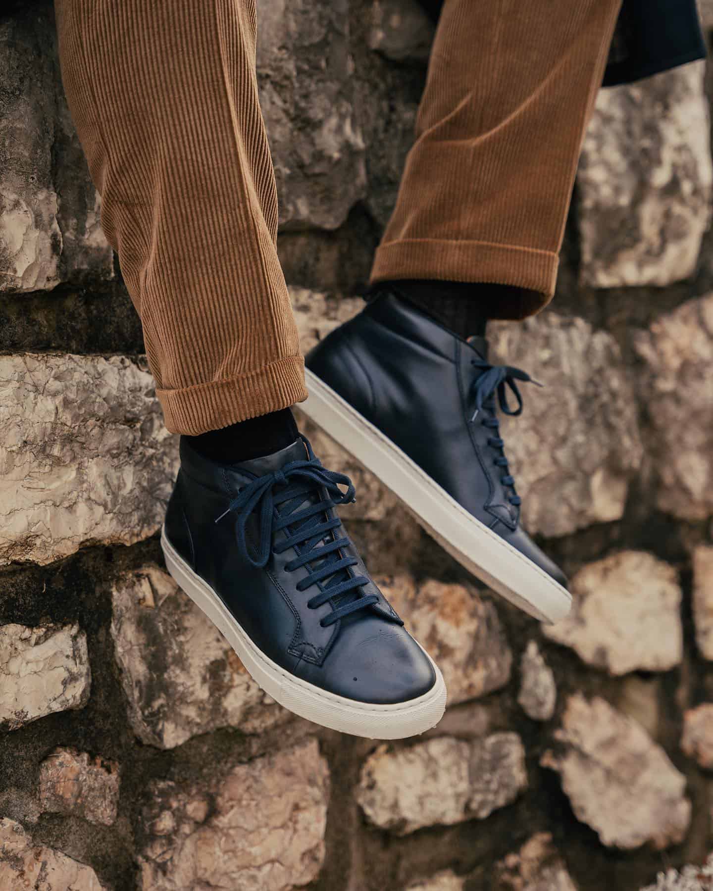 wearing a pair of ghisa high top sneakers by velasca