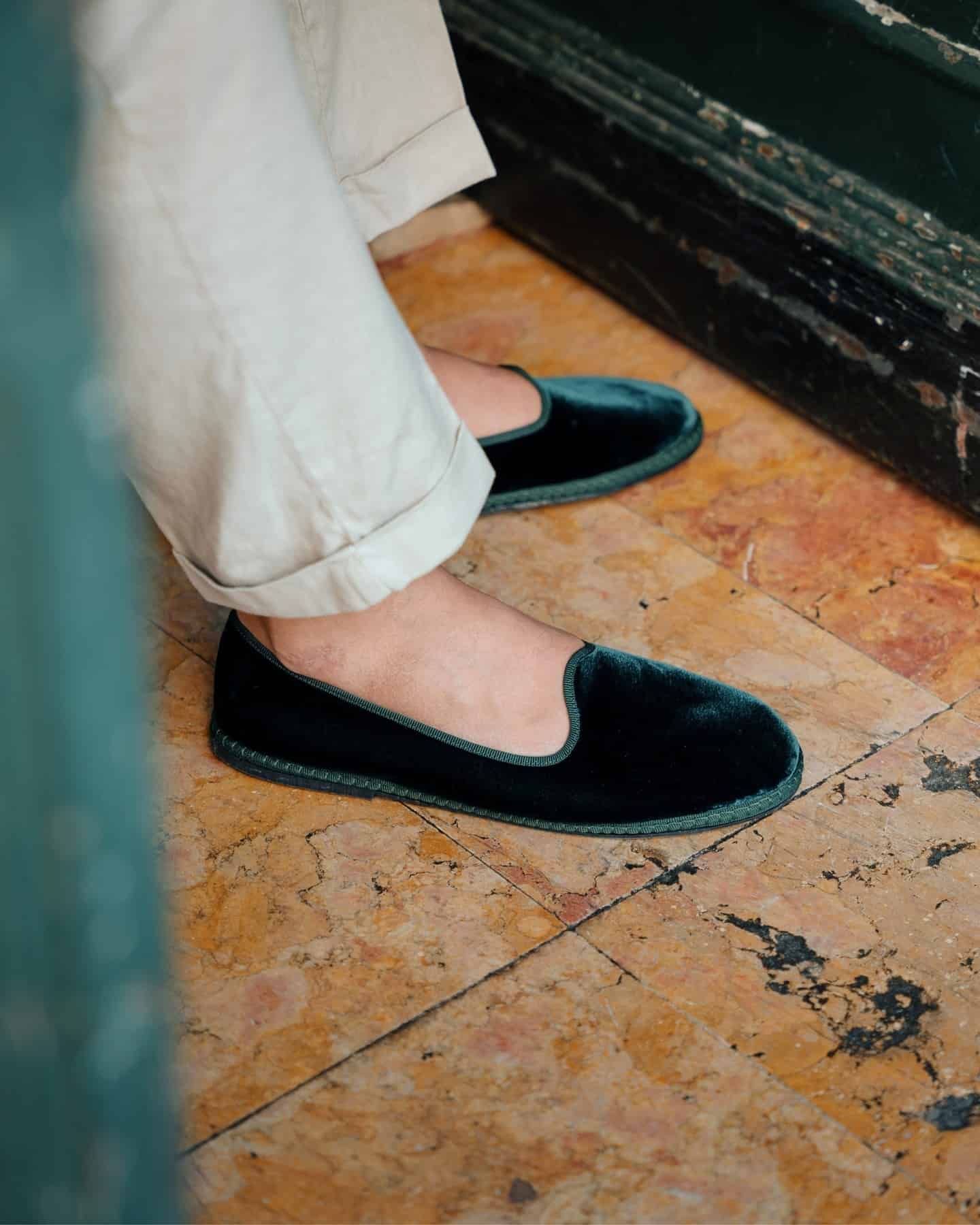 wearing a pair of velvet slippers by velasca