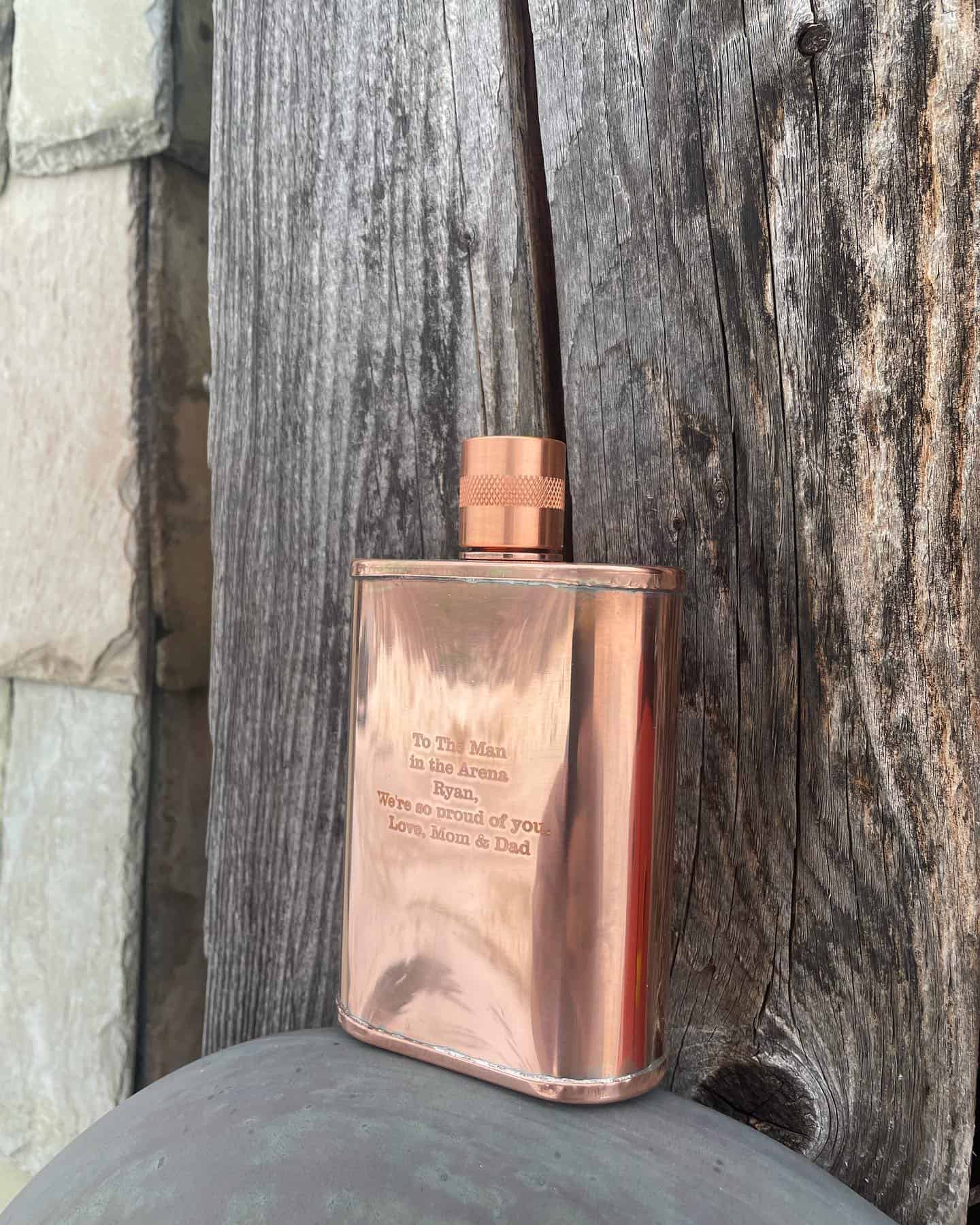 a customized copper flask with engraved dedication