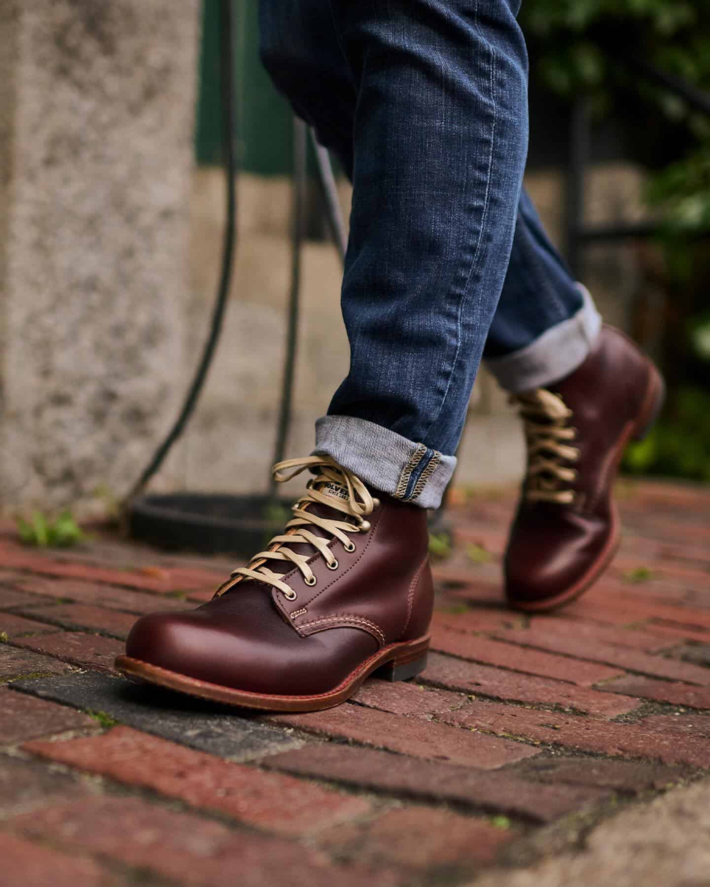 wearing a pair of leather boots by wolverine