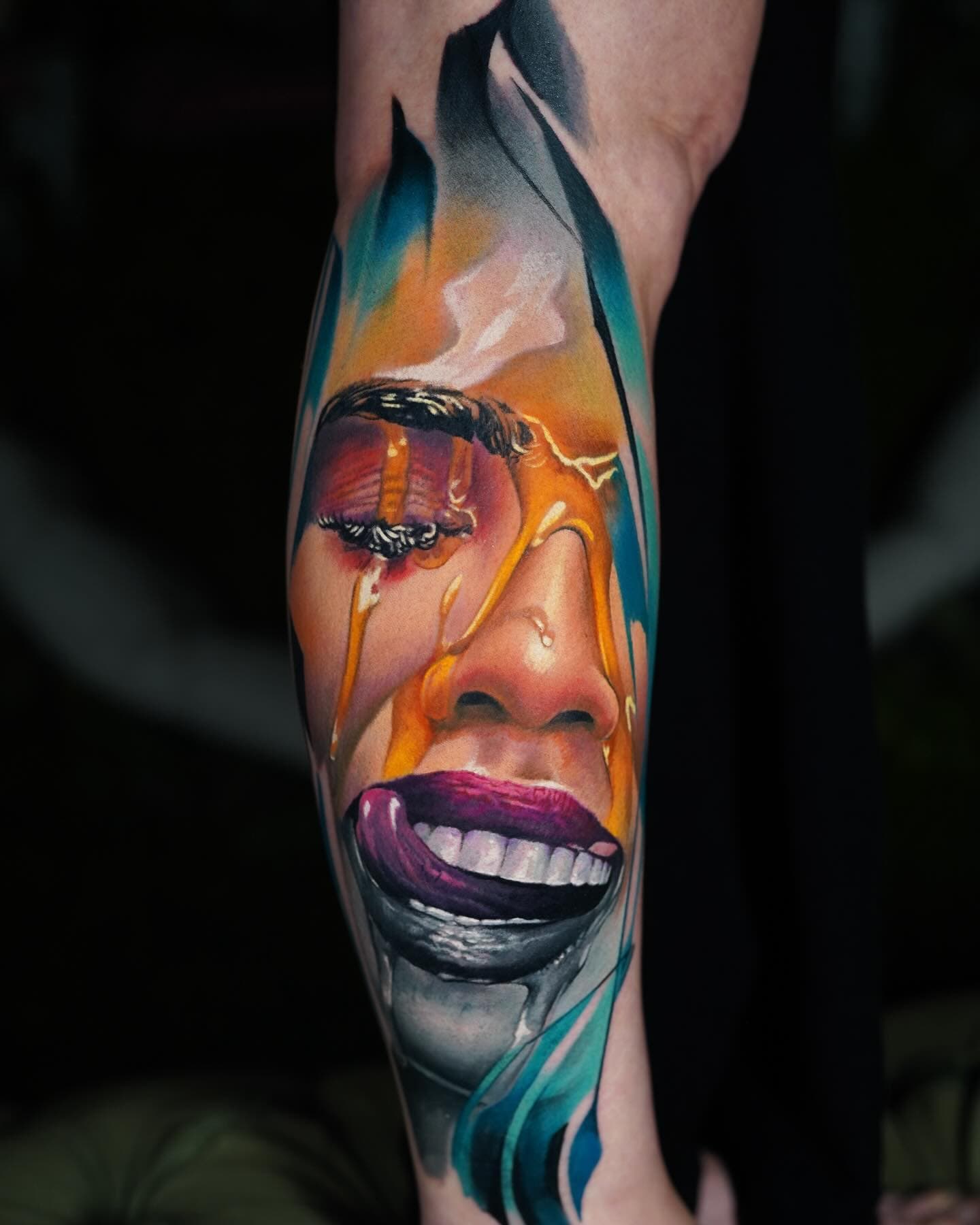 tattoo of woman's faced poured with honey on forearm