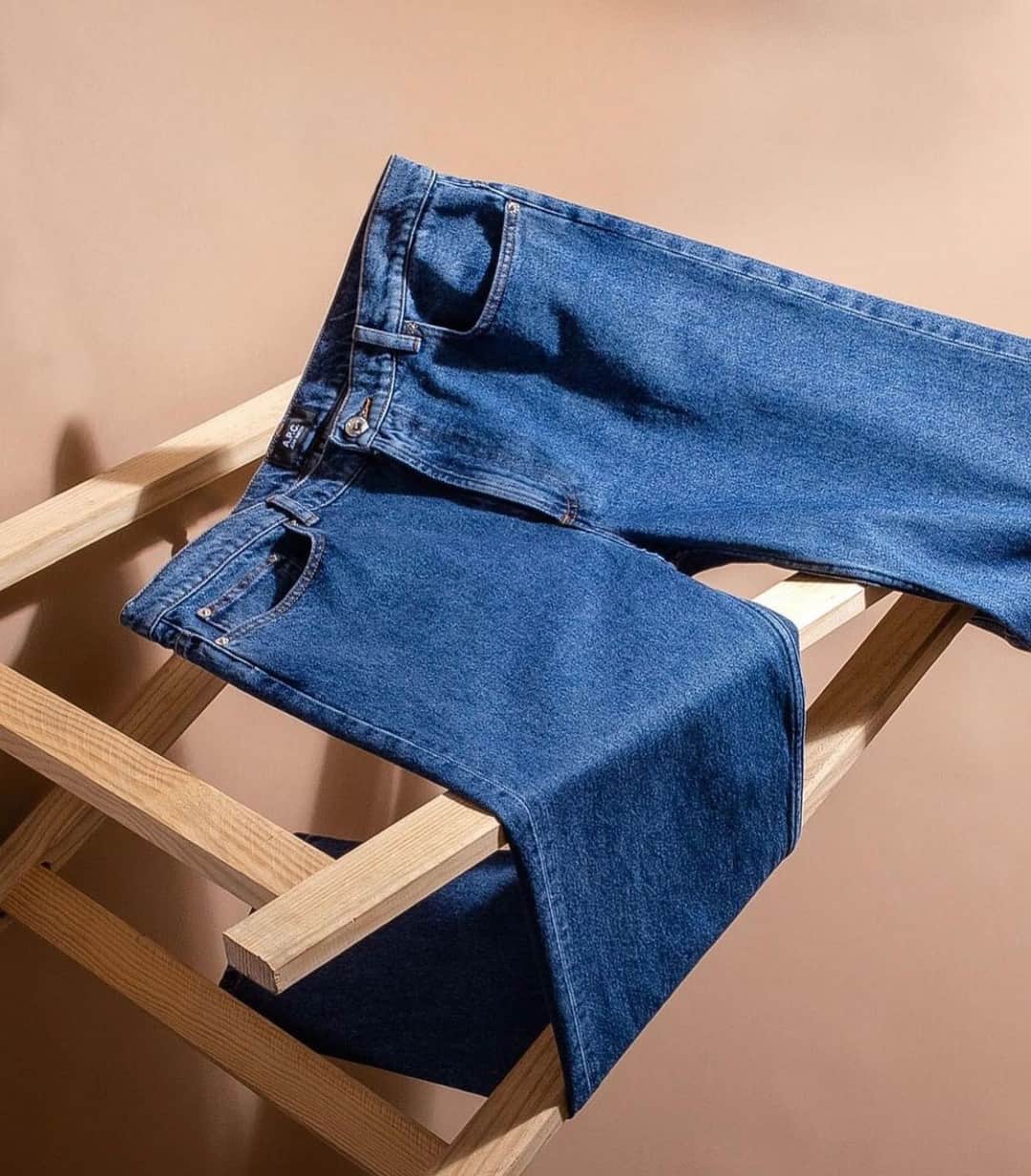 a pair of stonewashed indigo denim by apc