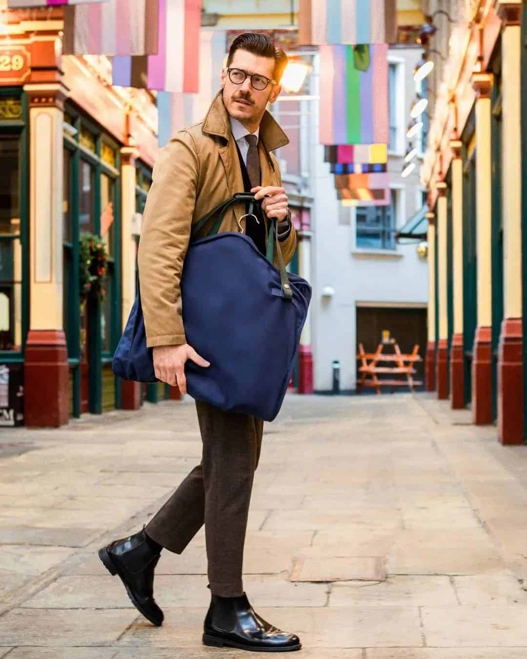 man carrying a suit carrier