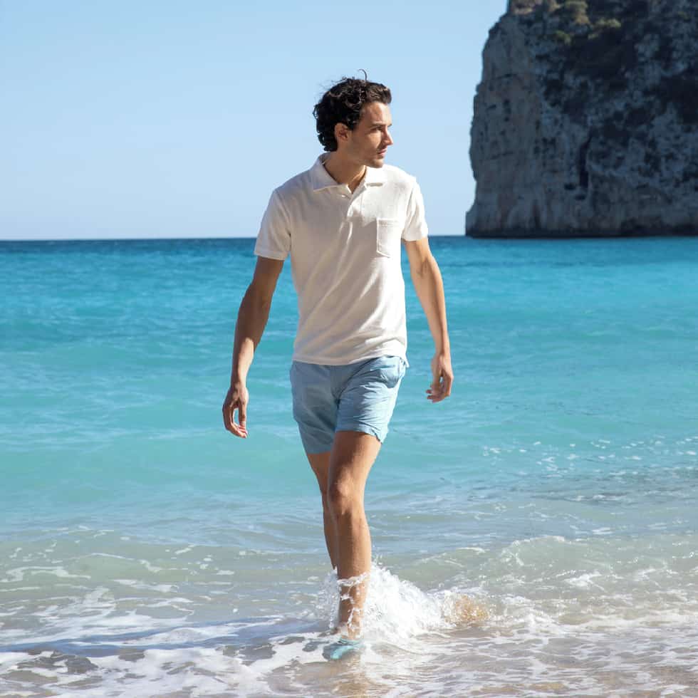 man walking in the beach