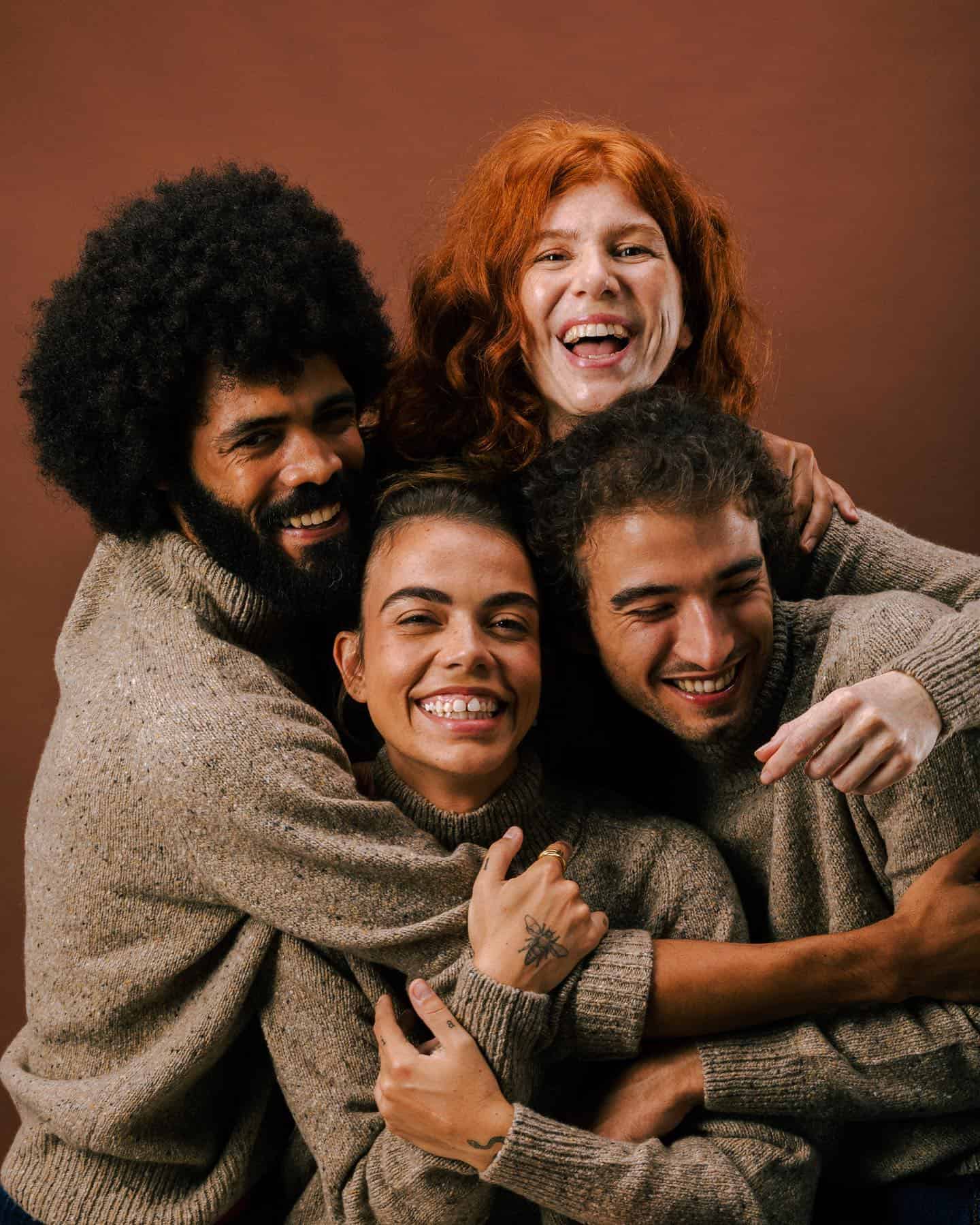 group of friends hugging each other