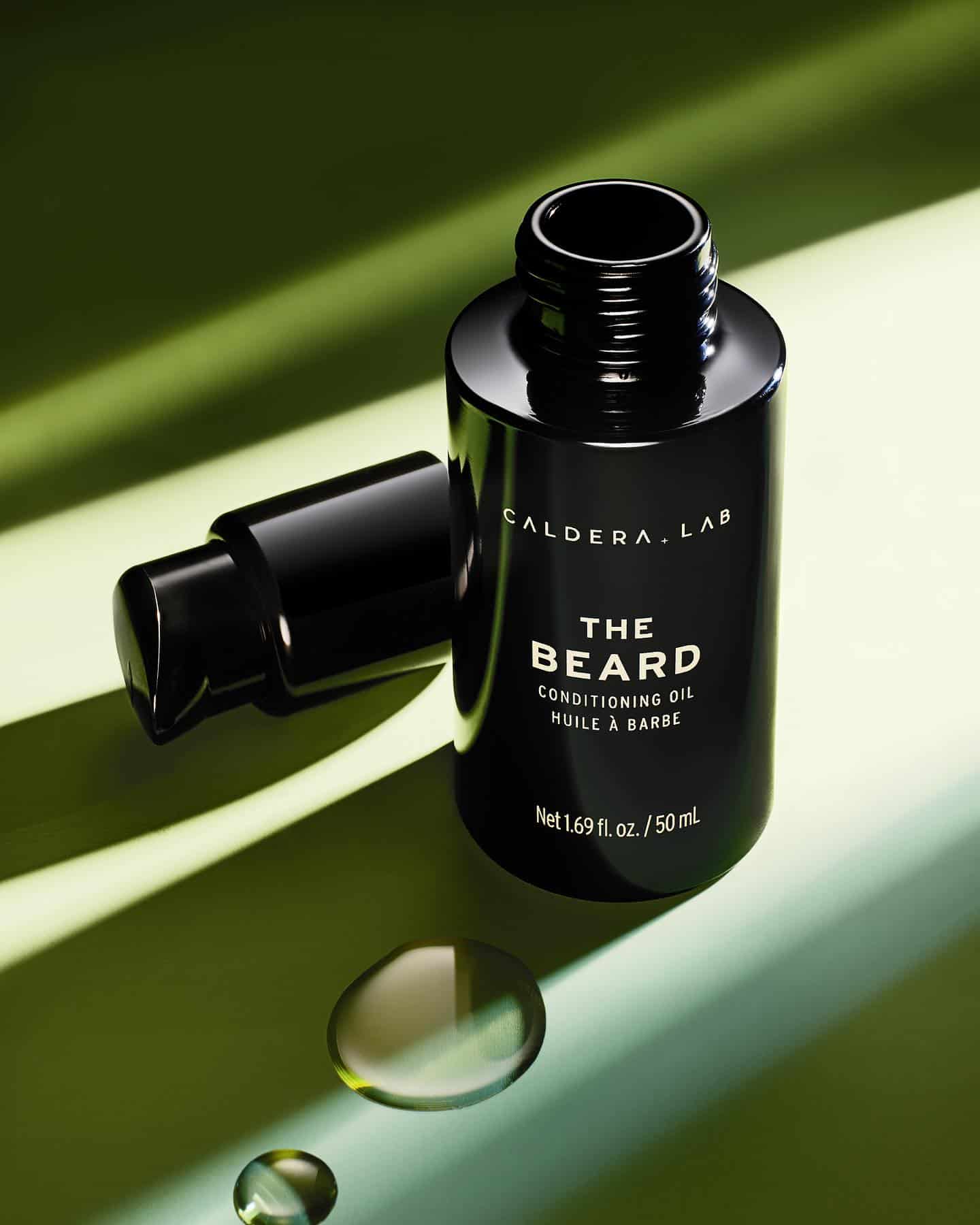 an open bottle of the beard conditioning oil by caldera lab