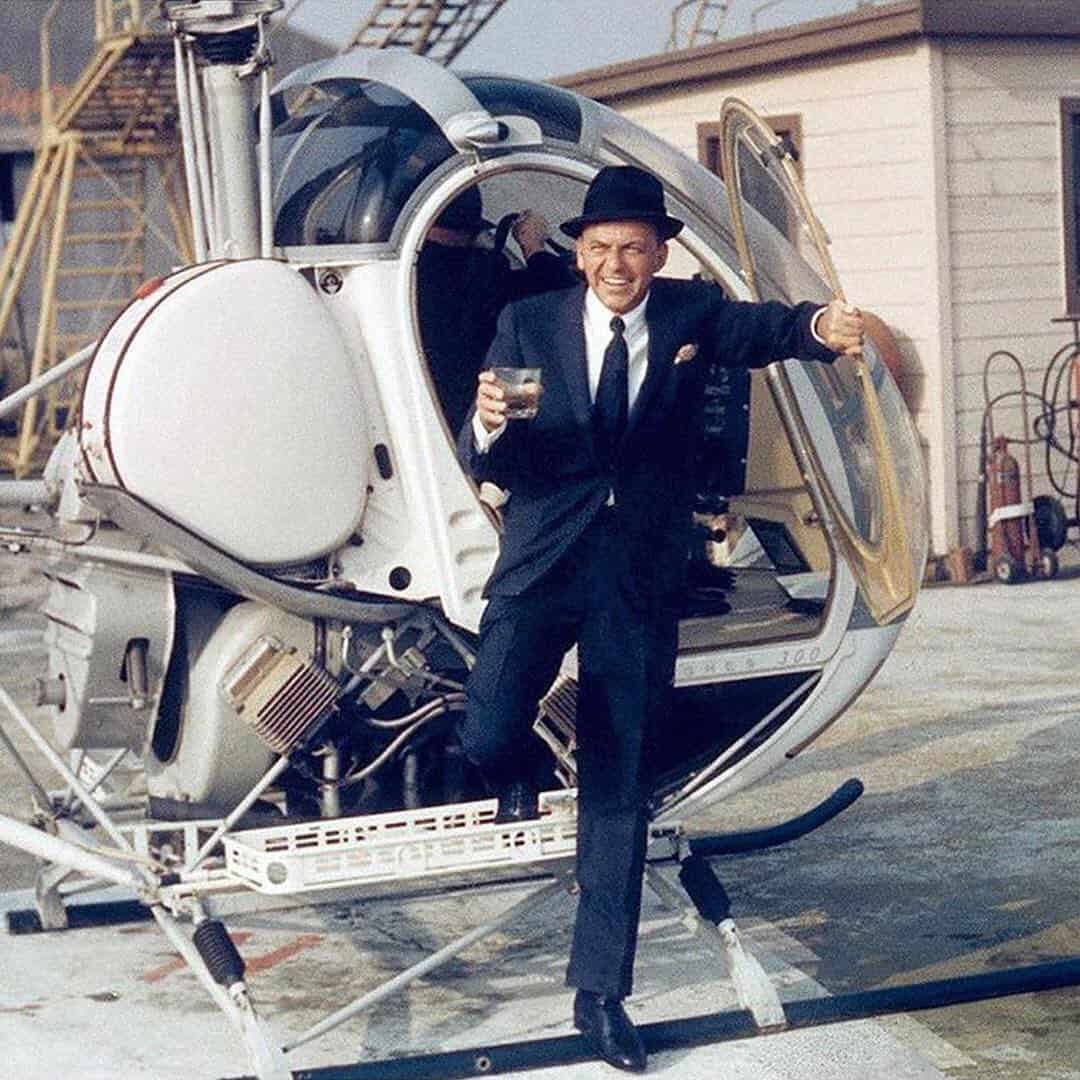 man getting down from a helicopter