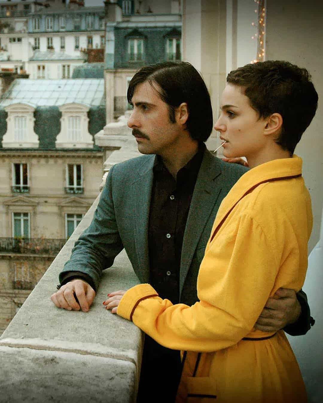 man grabbing a woman's waist on the balcony