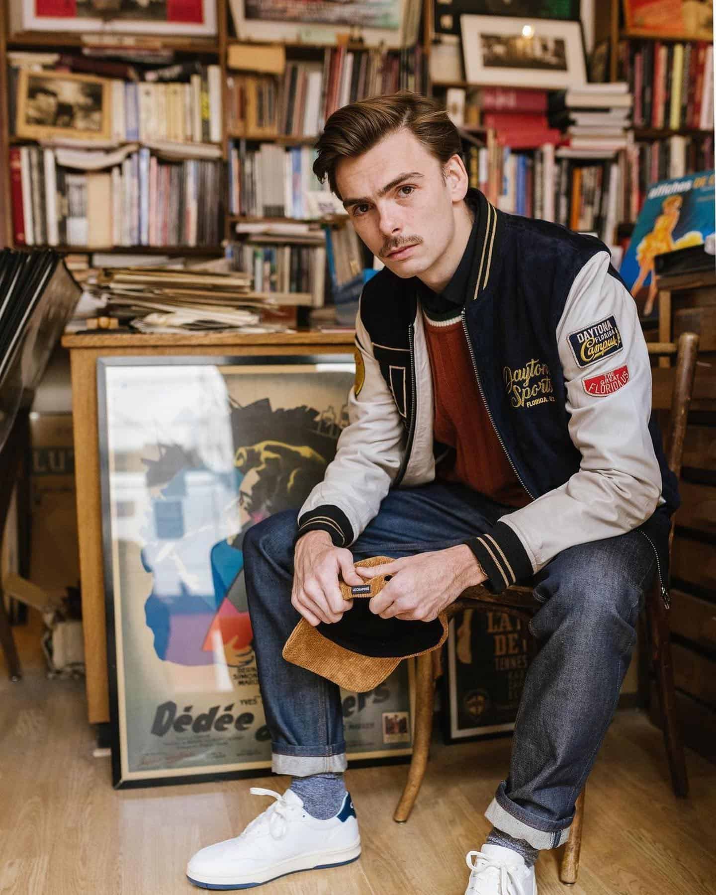 man wearing a varsity bomber jacket