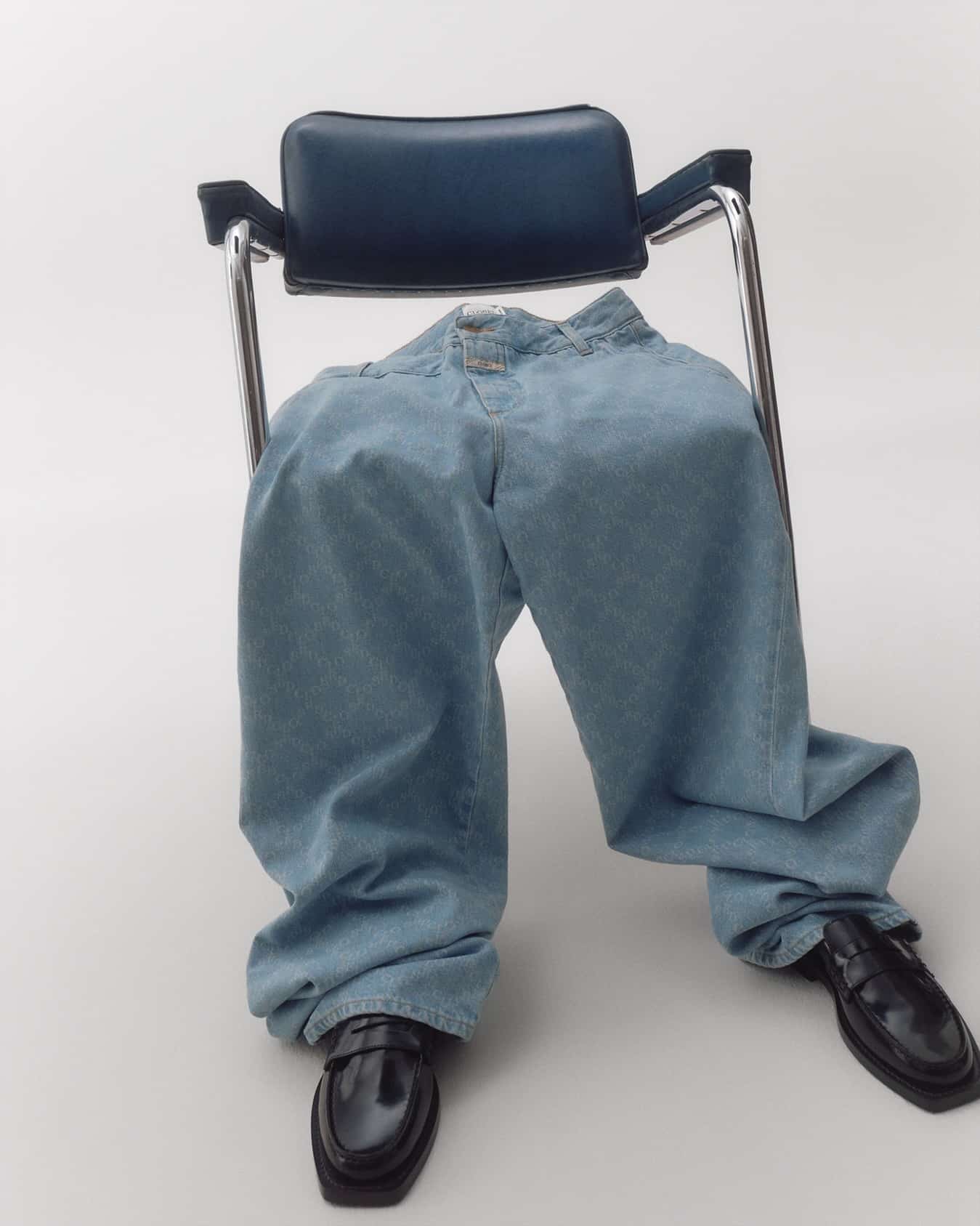 jeans on a chair and a pair of loafers