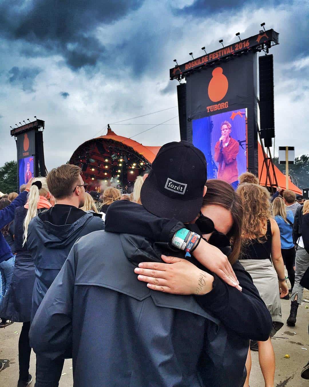 couples dancing to a song in a concert
