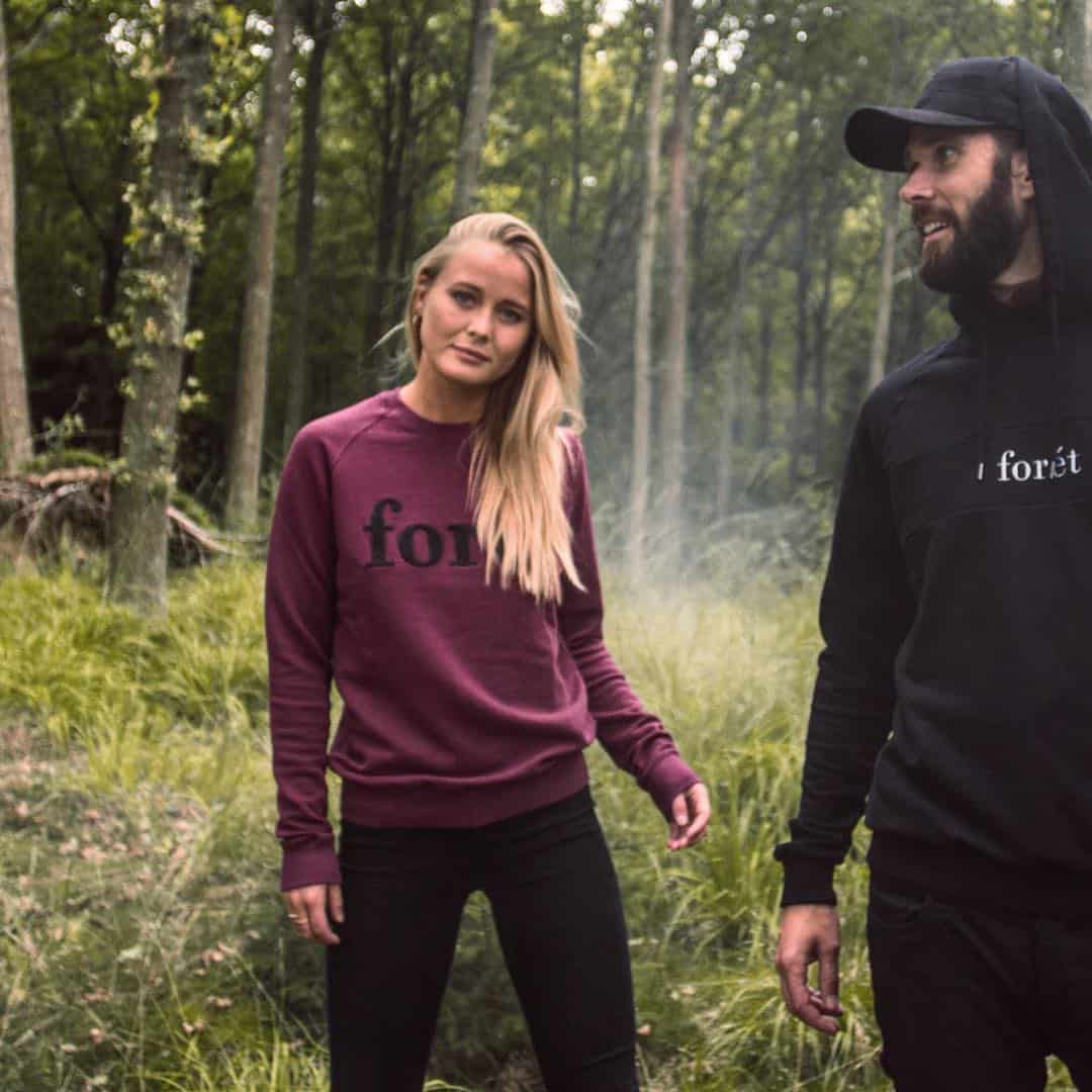couples taking a hike in the woods