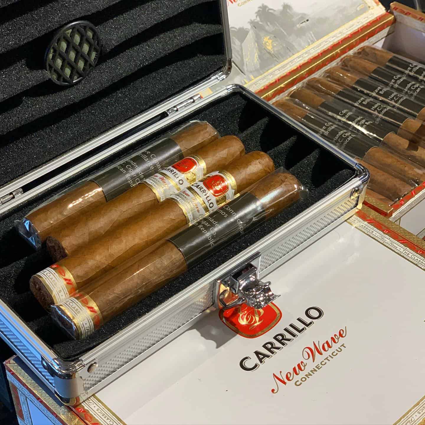 a travel humidor with four cigars inside