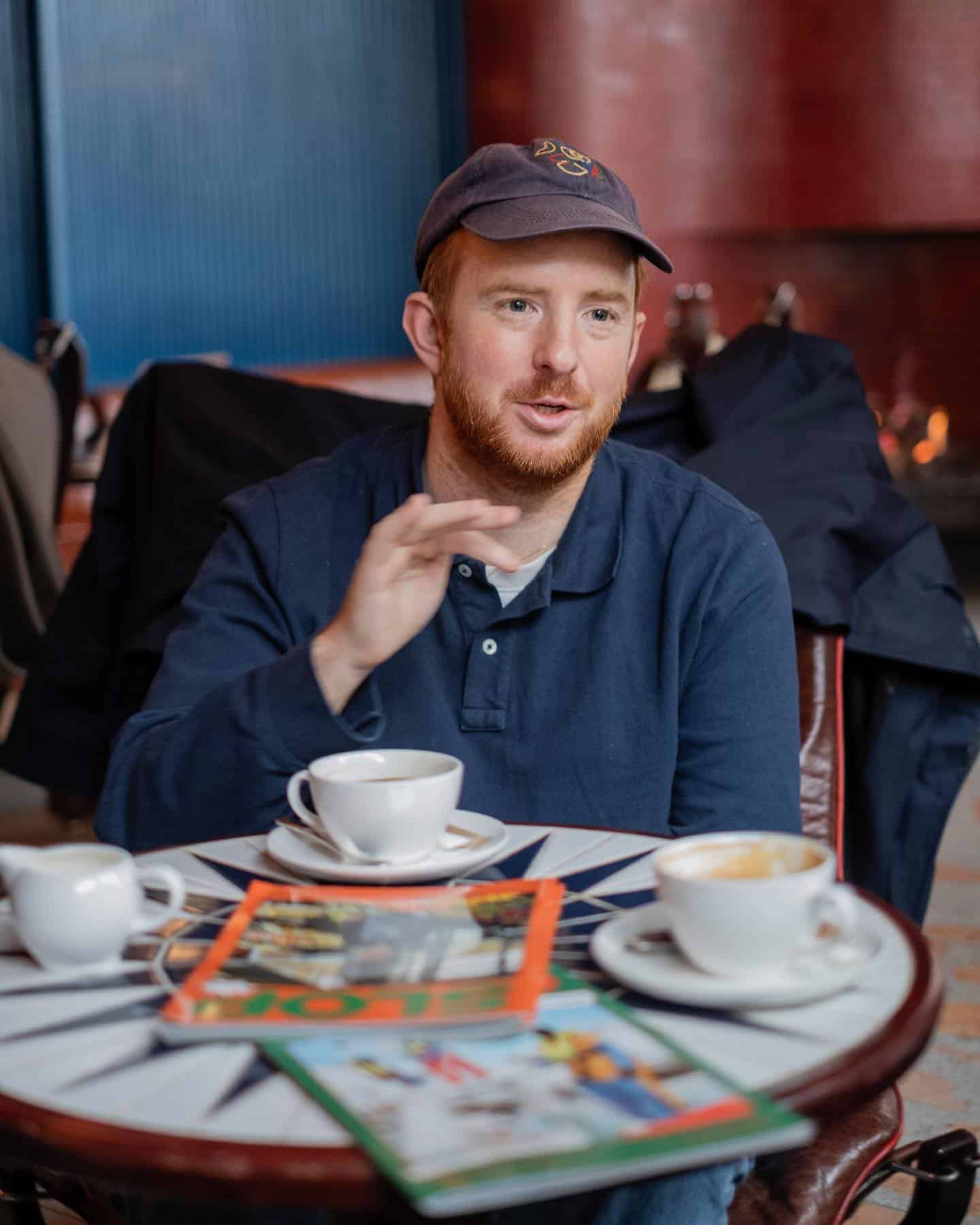 man having a conversation over coffee