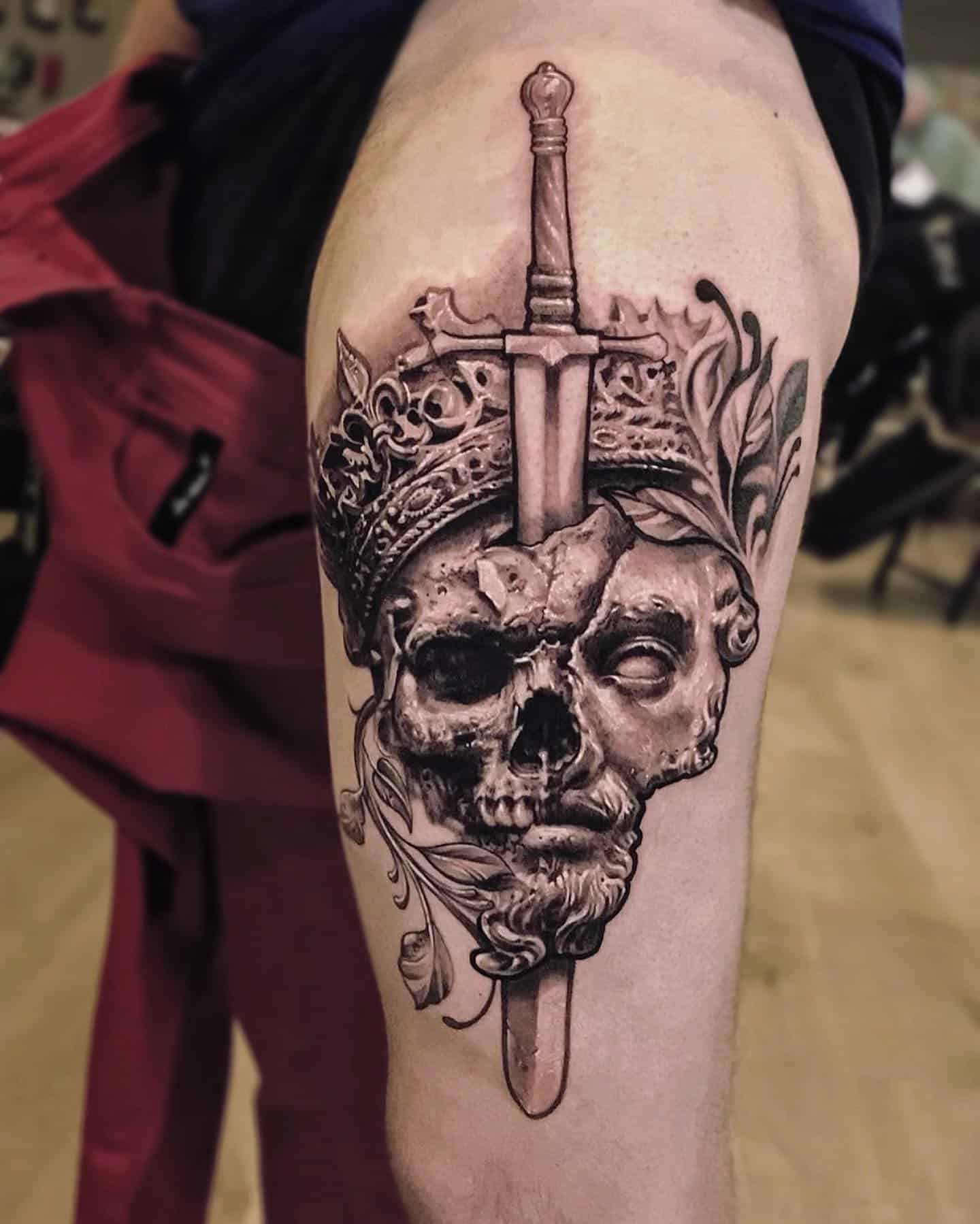 half skul half face tattoo on legs