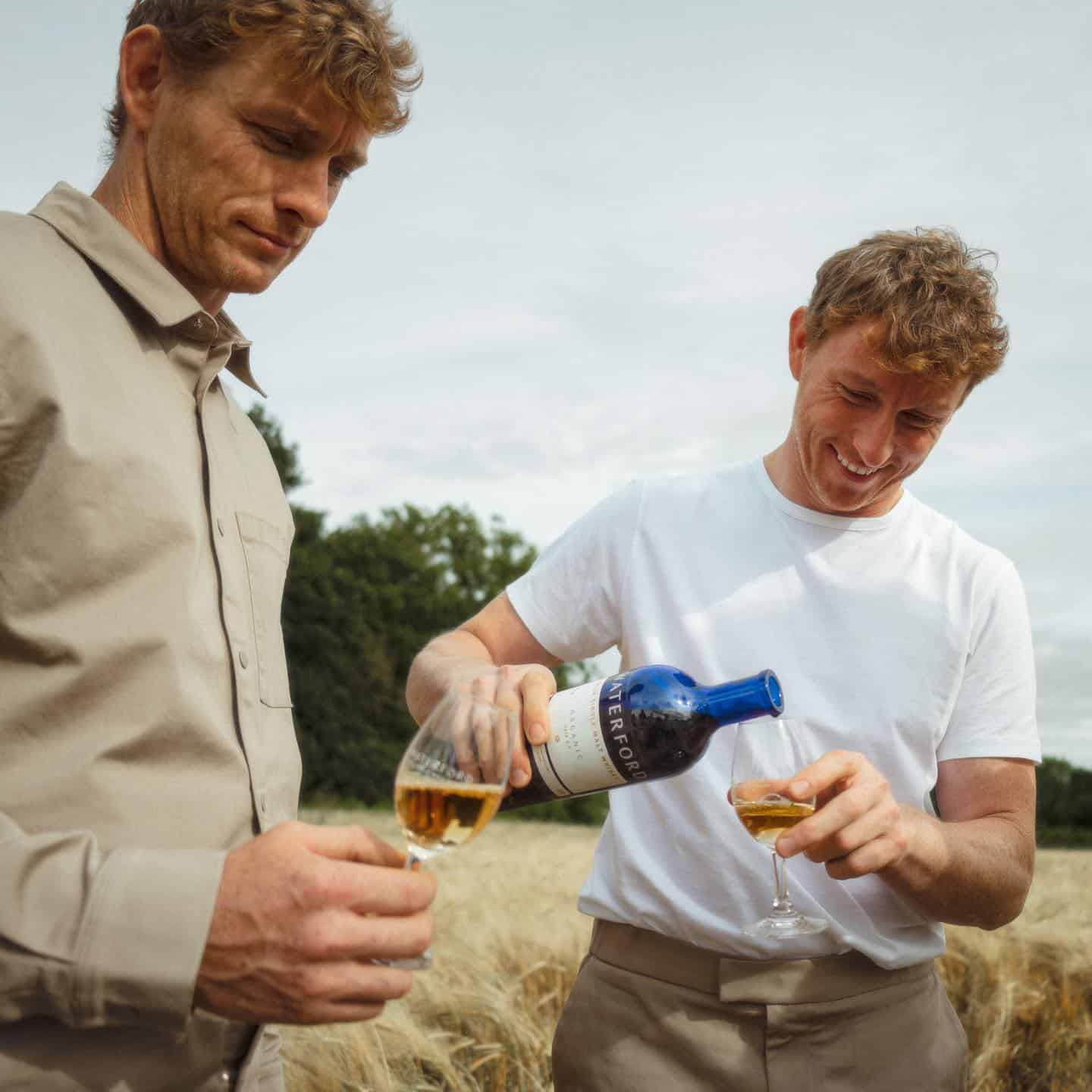 two men enjoying a glass of whisky