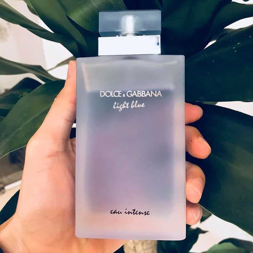 holding a bottle of light blue by dolce and gabbana