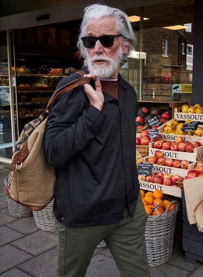 man carrying a tote bag