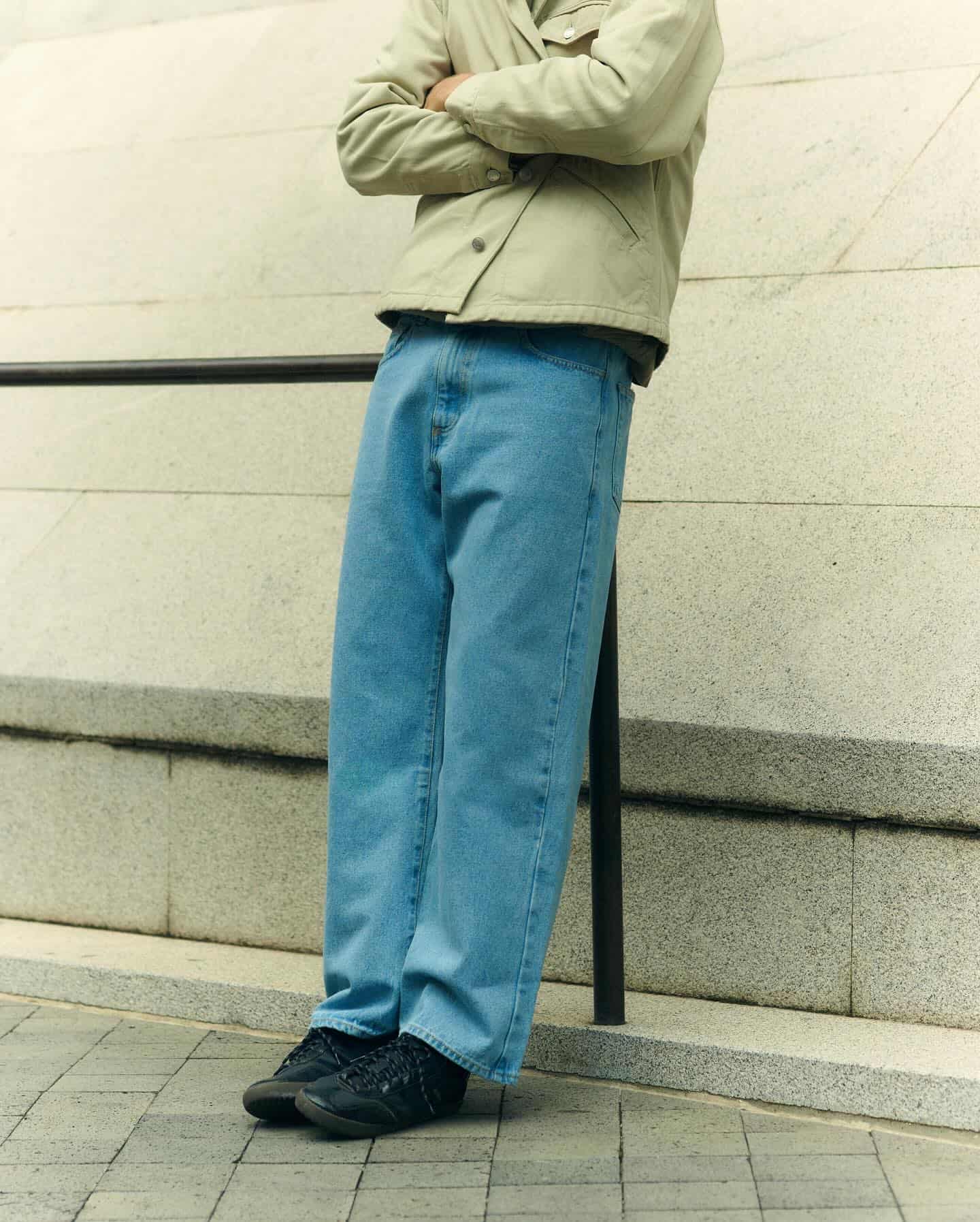 man resting his back at a hand railing